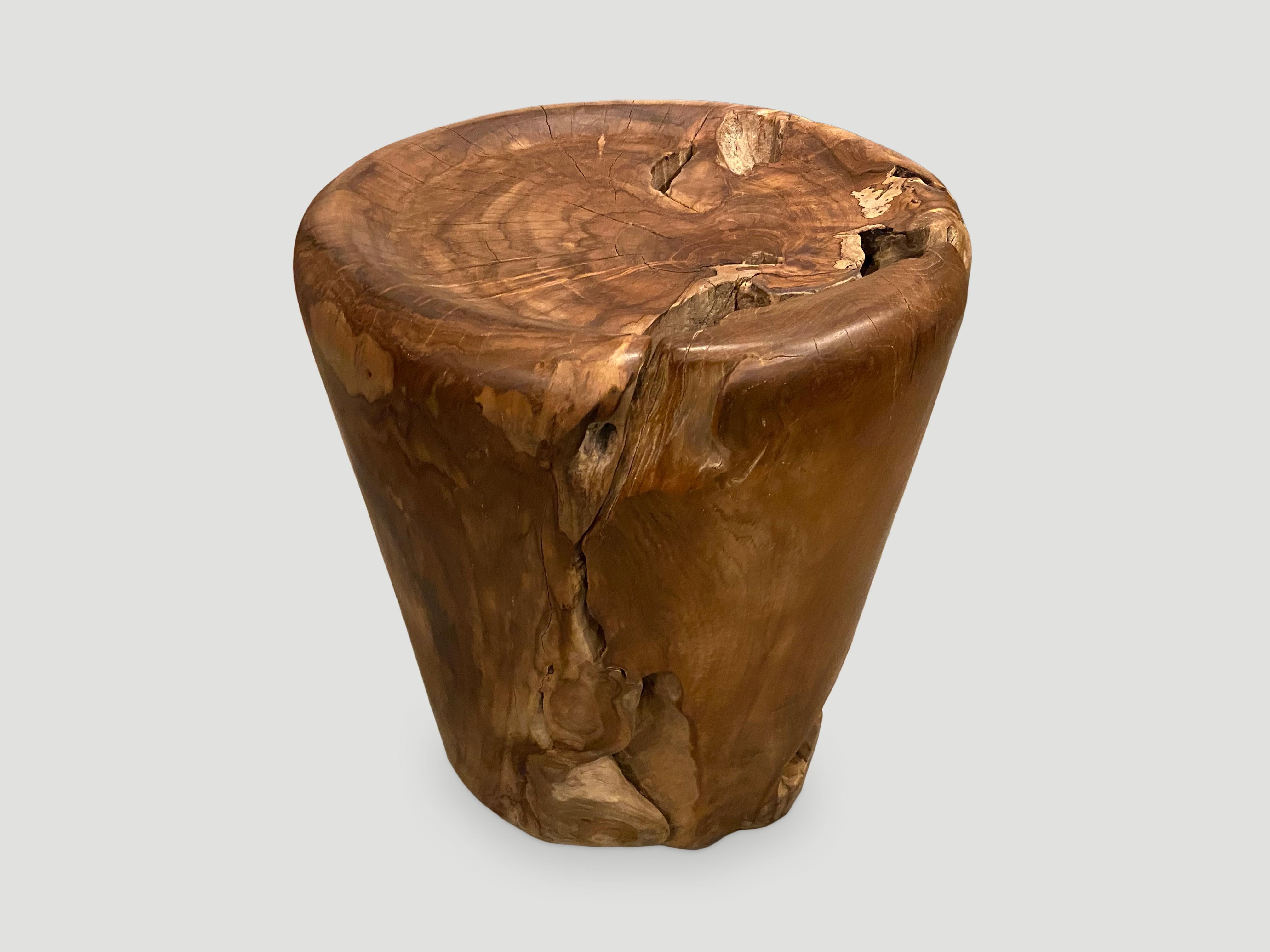 Natural organic formed reclaimed teak root side table. We hand carved the top section into a tray style and polished with a natural oil finish revealing the beautiful wood grain. There is a slight graduation from the top at 16
