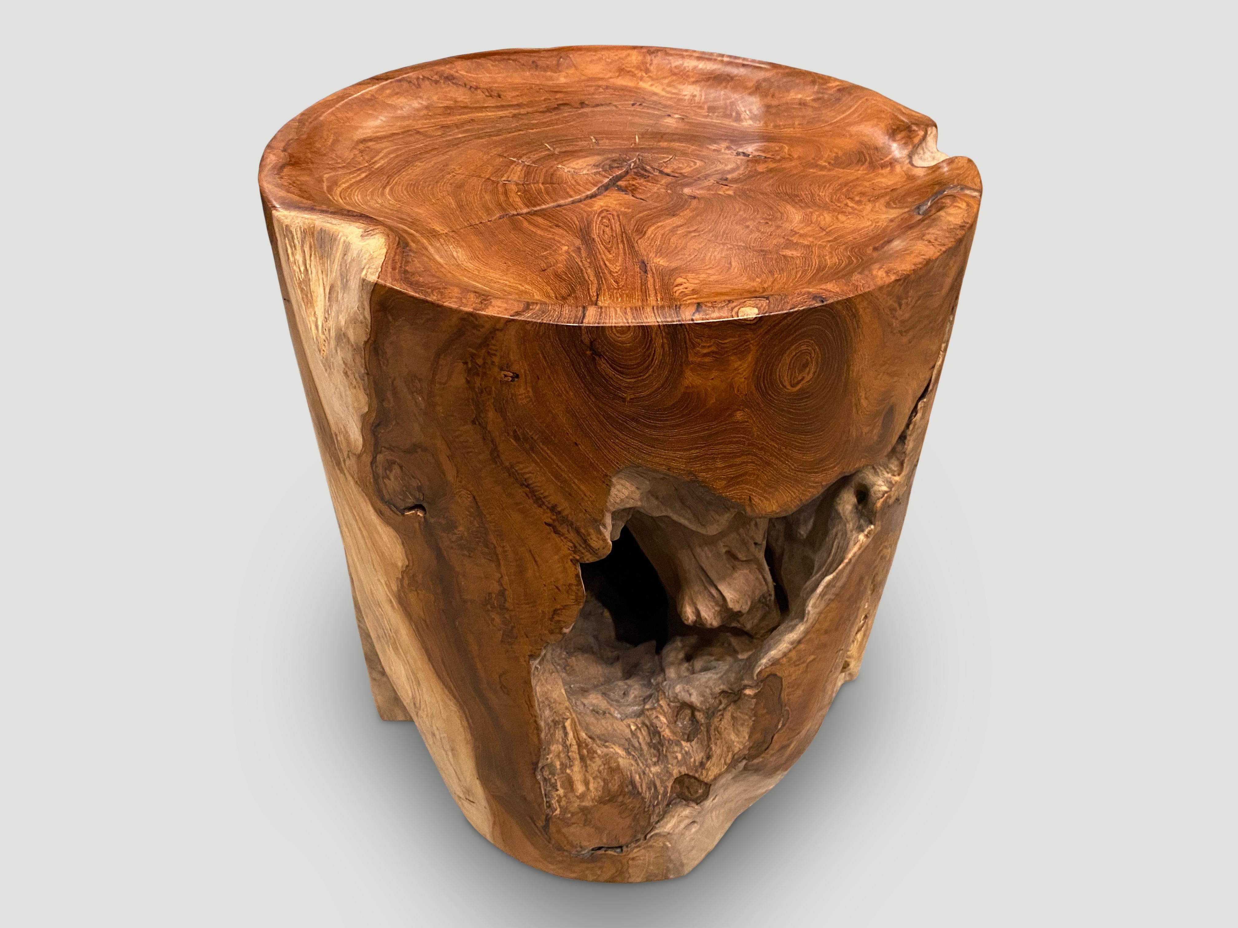 Natural organic formed reclaimed teak root side table. We hand carved the top section into a tray style and polished the aged teak with a natural oil finish revealing the beautiful wood grain. The inner sections are sanded and left unpolished in