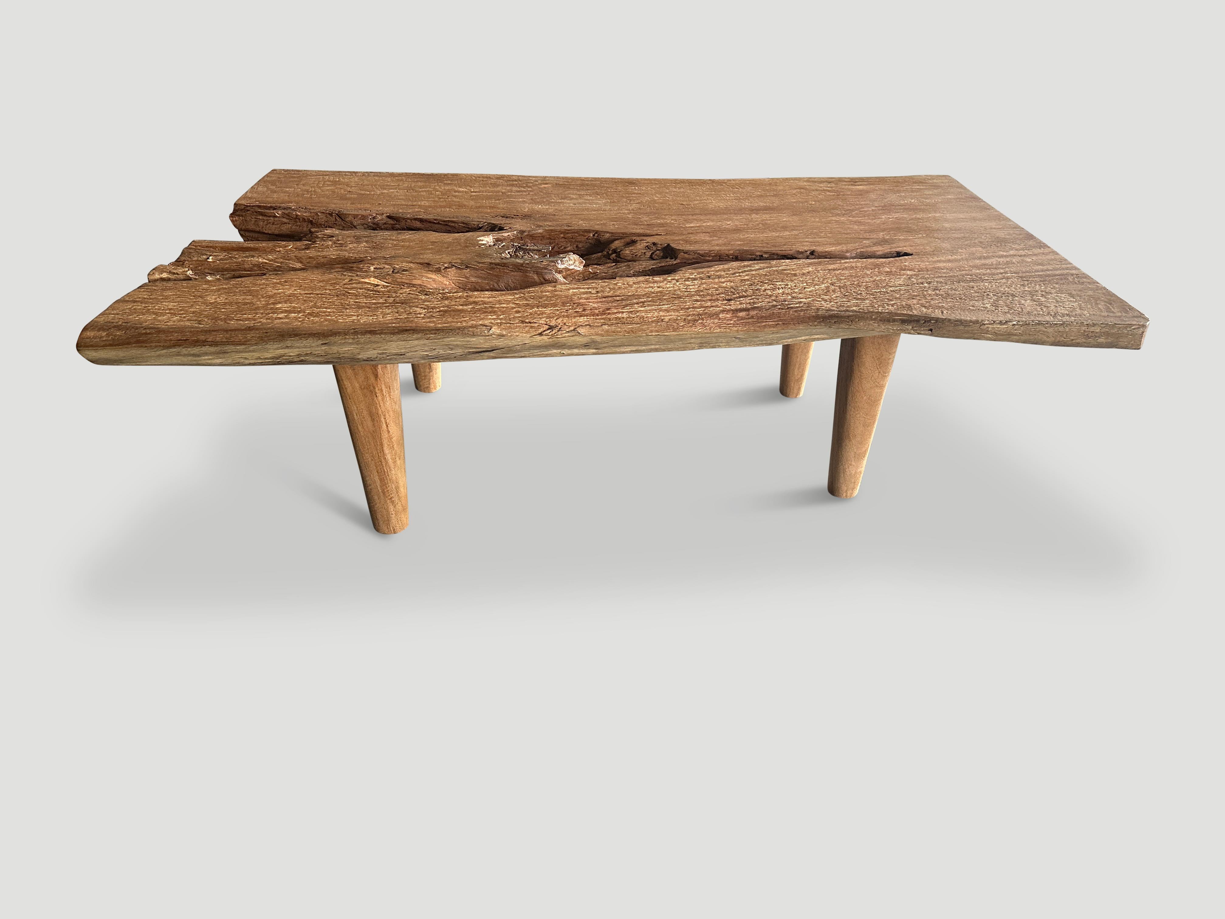 An impressive thick suar wood slab is shaped to produce this one of a kind coffee table, whilst respecting the natural organic wood. We added minimalist cylinder legs to this single slab and finished with a natural oil revealing the beautiful wood
