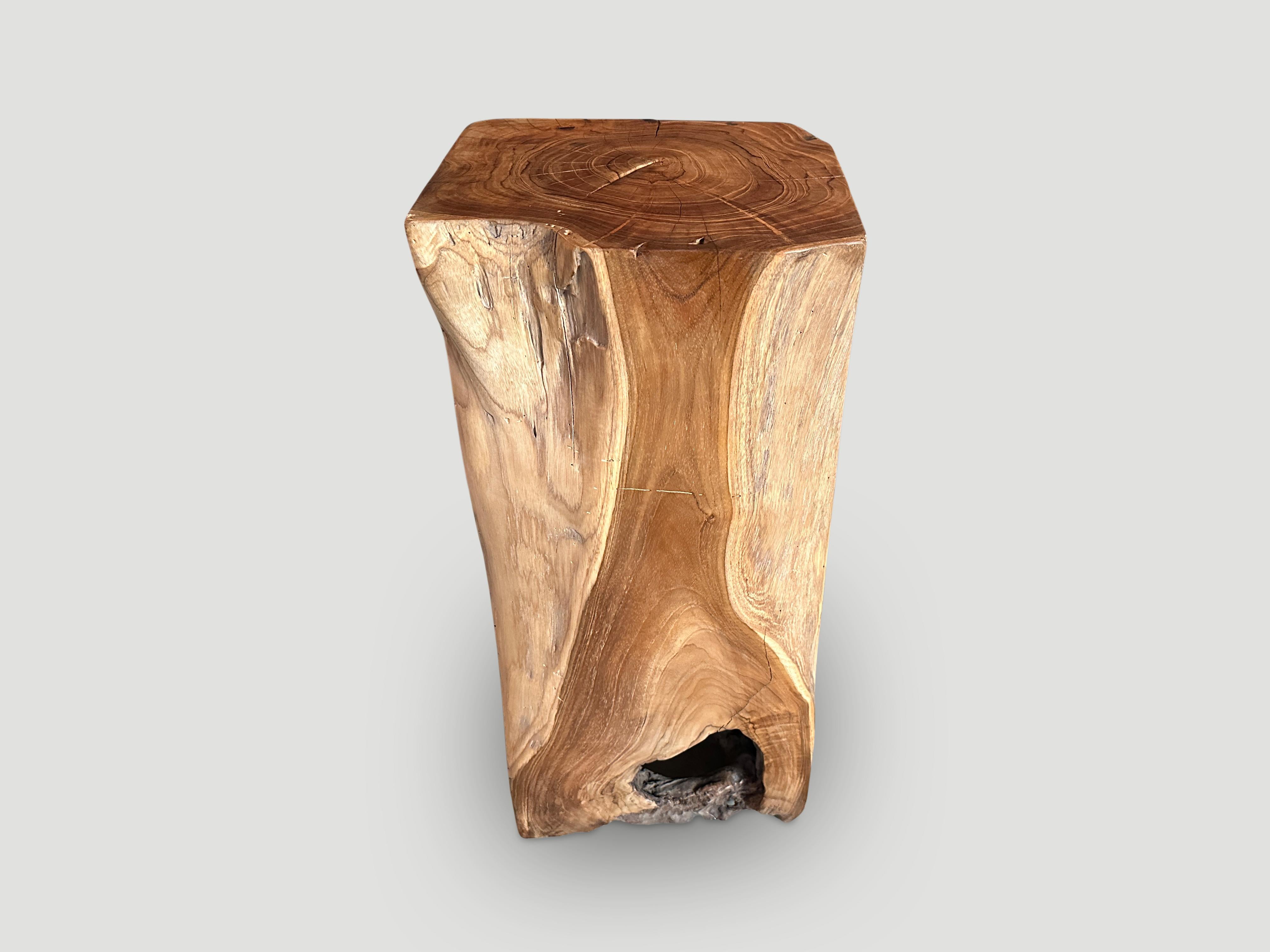 Reclaimed teak wood pedestal or side table hand carved into this usable shape whilst respecting the organic wood. Polished with a natural oil revealing the beautiful wood grain and textures. Both usable and sculptural.

This side table or pedestal