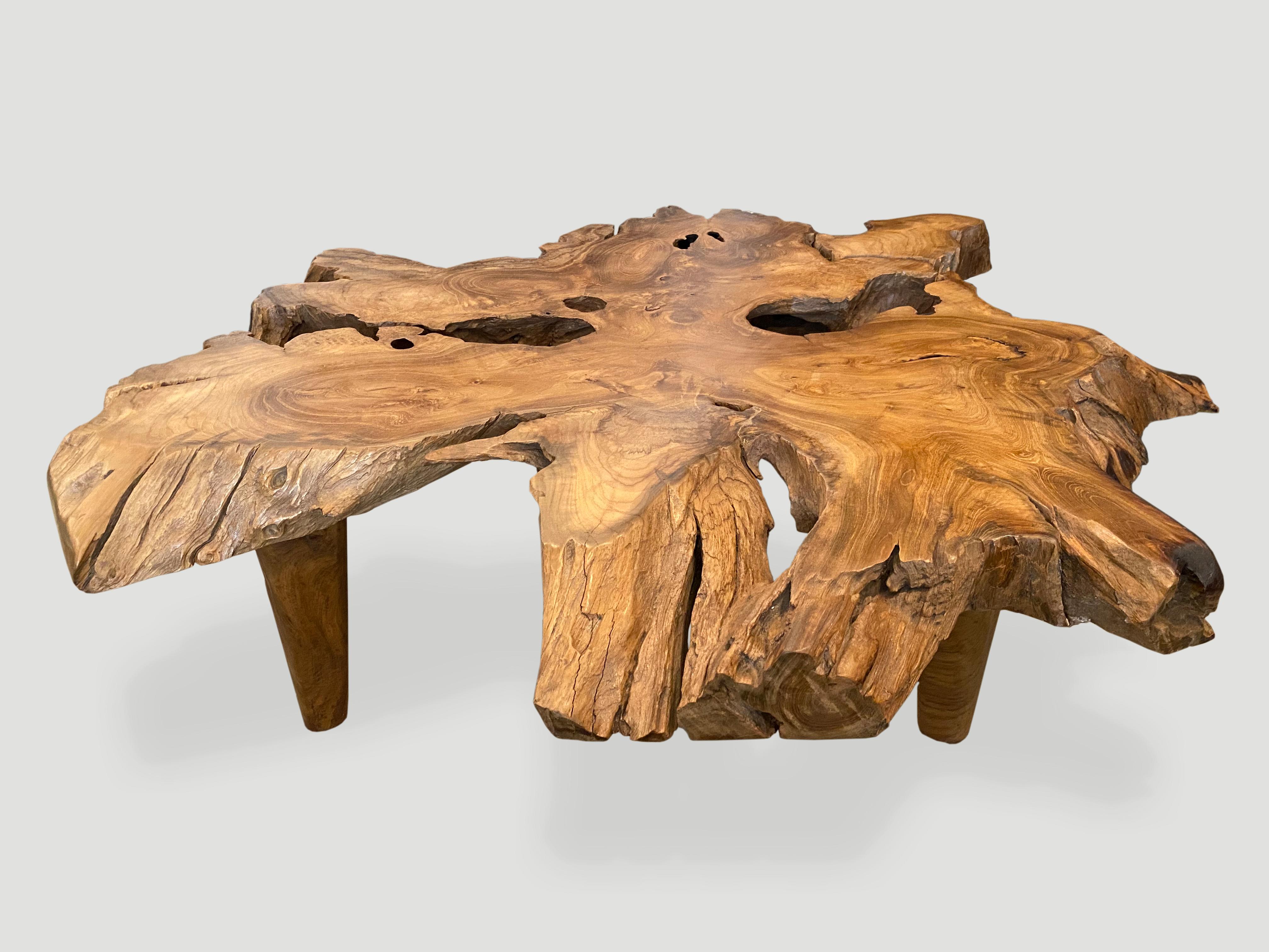 Impressive four inch reclaimed teak wood coffee table with a natural oil polished top. The sides are left natural in contrast. Floating on mid century style teak cone legs. Organic with a twist.

Own an Andrianna Shamaris original.

Andrianna