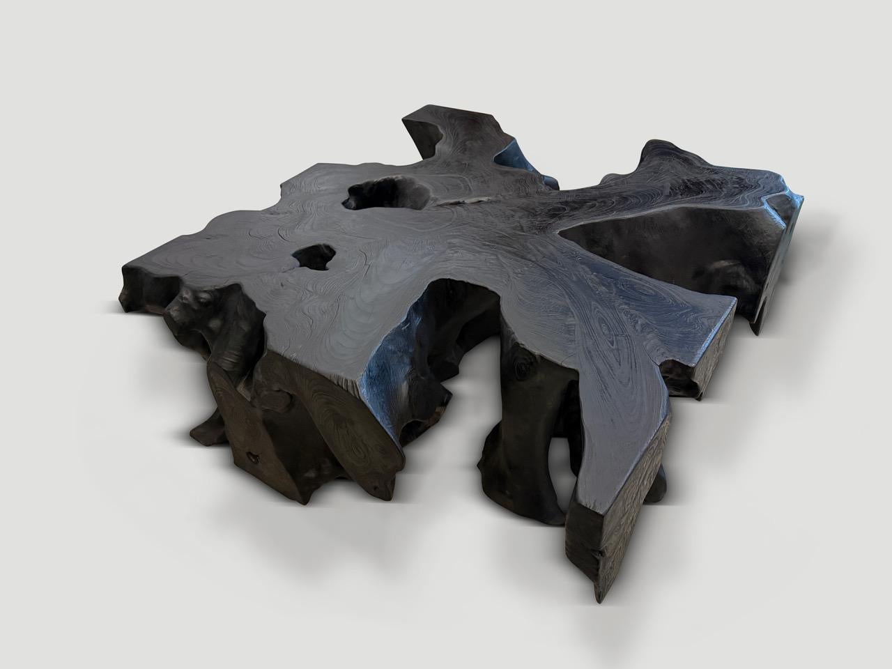 Organic reclaimed teak wood coffee table hand made from a single 16” thick root. Charred sanded and sealed revealing the beautiful wood grain. It’s all in the details.

The Triple Burnt Collection represents a unique line of modern furniture and art