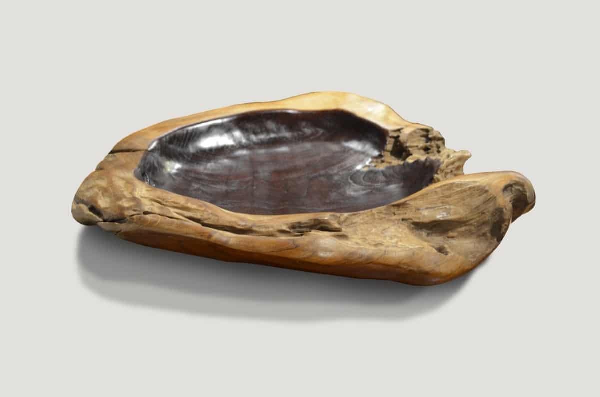 The organic teak wood vessel serves as a stunning sculptural piece and a practical addition to hold fruit, magazines, towels, etc. Carved from a single piece of reclaimed teak wood.

Andrianna Shamaris, Inc. The leader in modern organic design.
