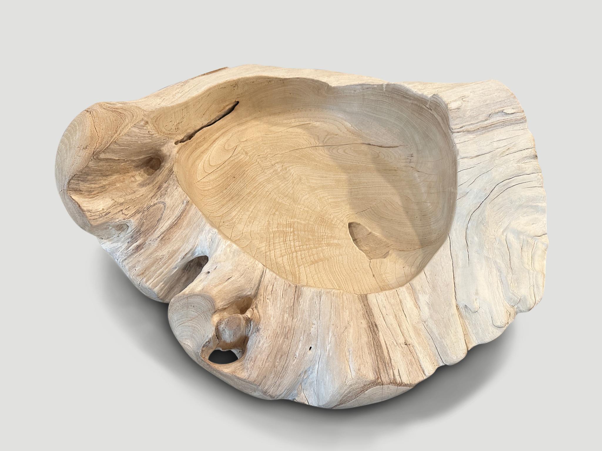 Impressive size on this reclaimed teak sculptural vessel. Hand carved from a single piece of reclaimed teak wood and bleached with a smooth finish. We added a polish to the inner section as protection and for a little contrast and also to the smooth