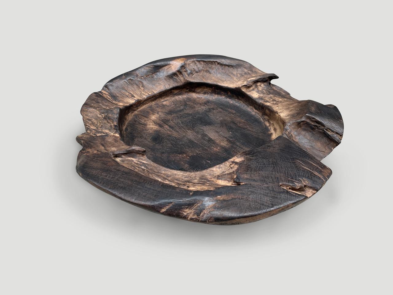 Impressive size on this reclaimed teak sculptural vessel. Great as an art object or useful to hold towels or magazines to name a few suggestions. Hand carved from a single piece of reclaimed teak wood and charred one time revealing the beautiful