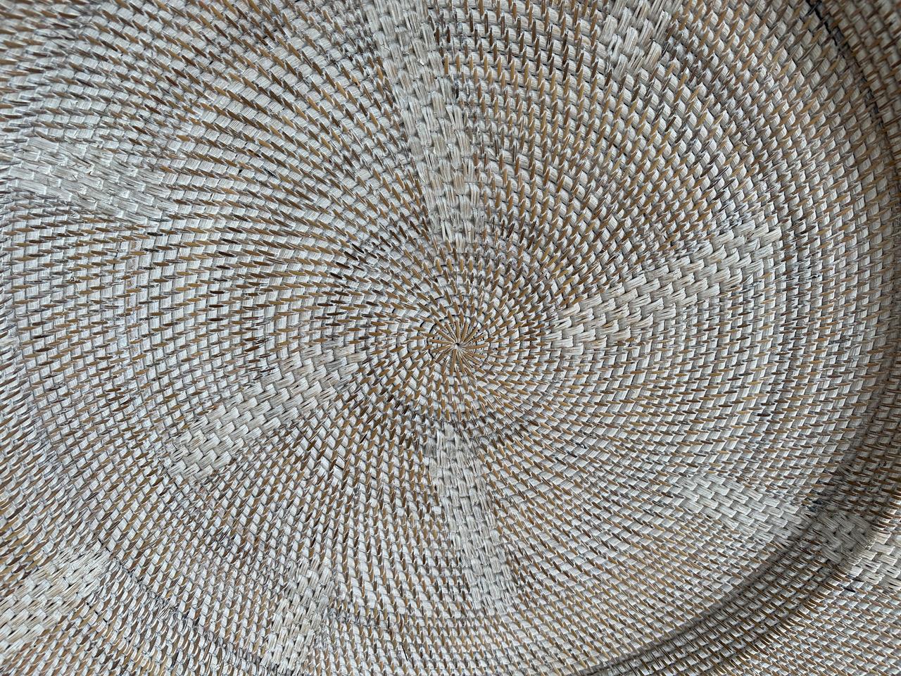 Beautiful oversized hand woven rattan platter. We added a white wash to this impressive piece. Fabulous hung on a wall, to hold towels by a pool, or to place magazines to name a few suggestions.

Own an Andrianna Shamaris original.

Andrianna