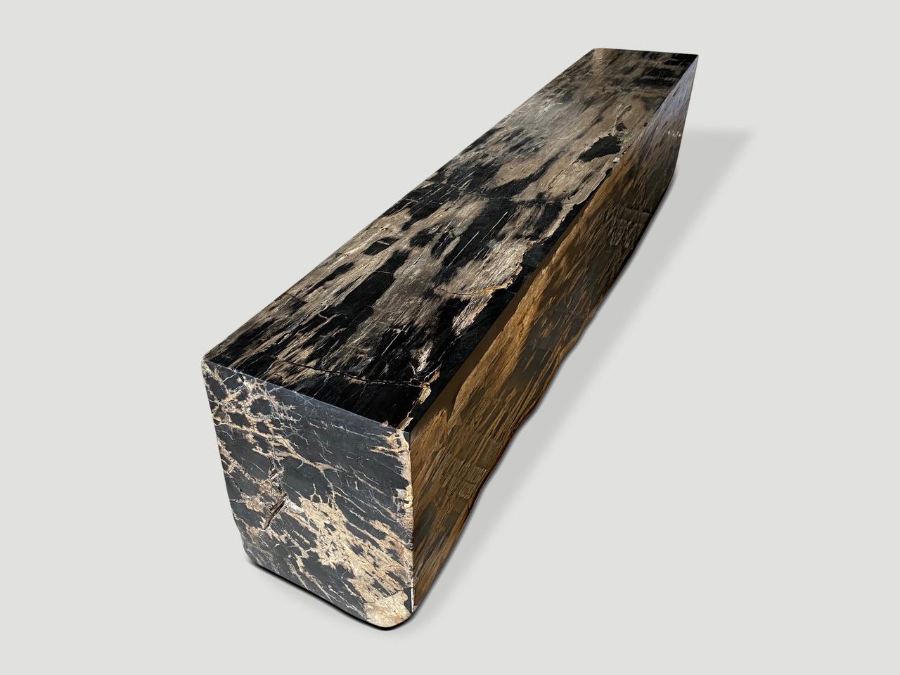 Beautiful long petrified wood bench. It’s fascinating how Mother Nature produces these exquisite 40 million year old petrified teak logs with such contrasting colors and natural markings throughout. Modern yet with so much history. Fabulous in a