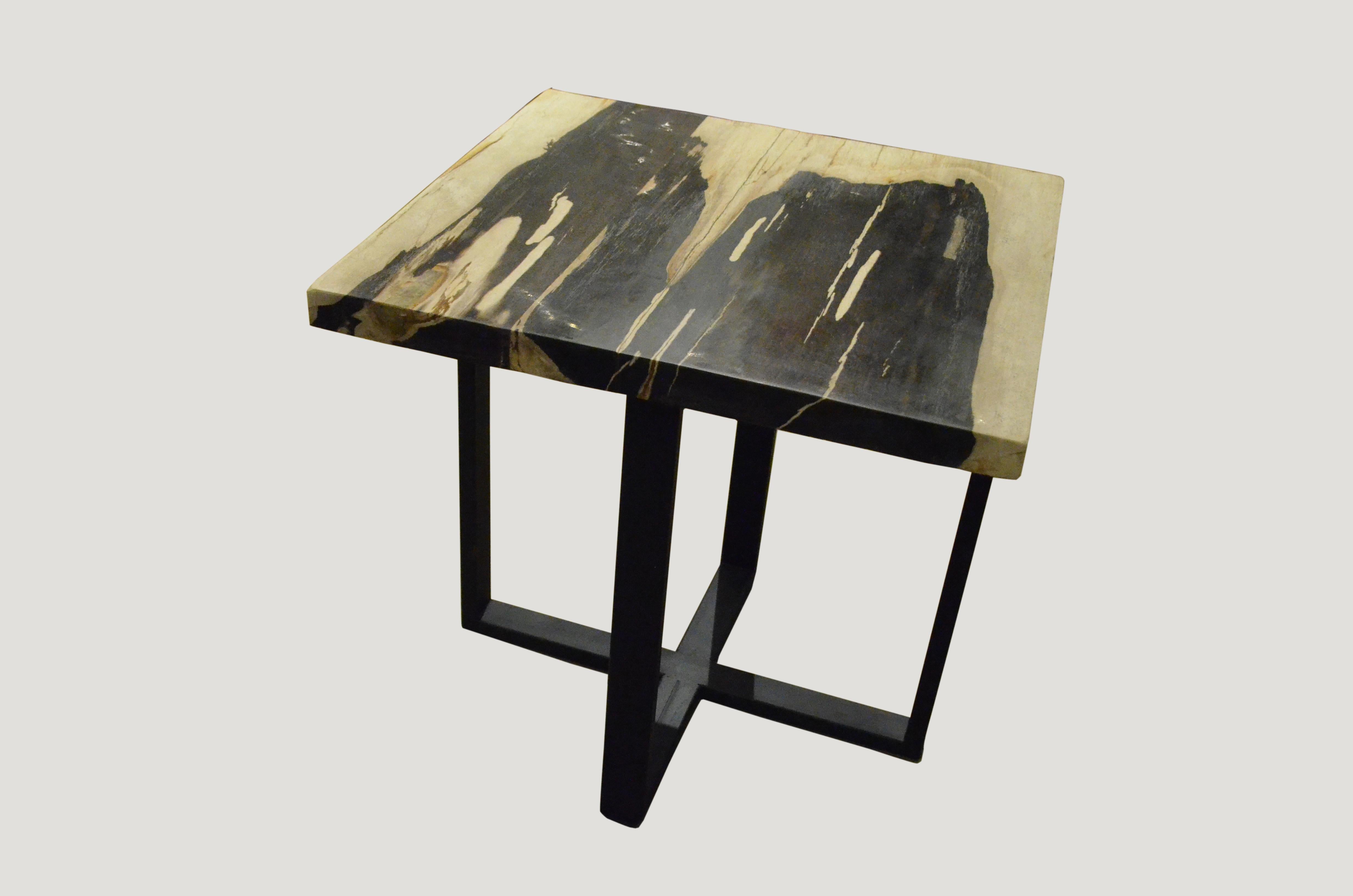 Beautiful petrified wood slab top side table in contrasting tones. Set on a modern black steel base.

As with a diamond, we polish the highest quality fossilized petrified wood, using our latest ground breaking technology, to reveal its natural