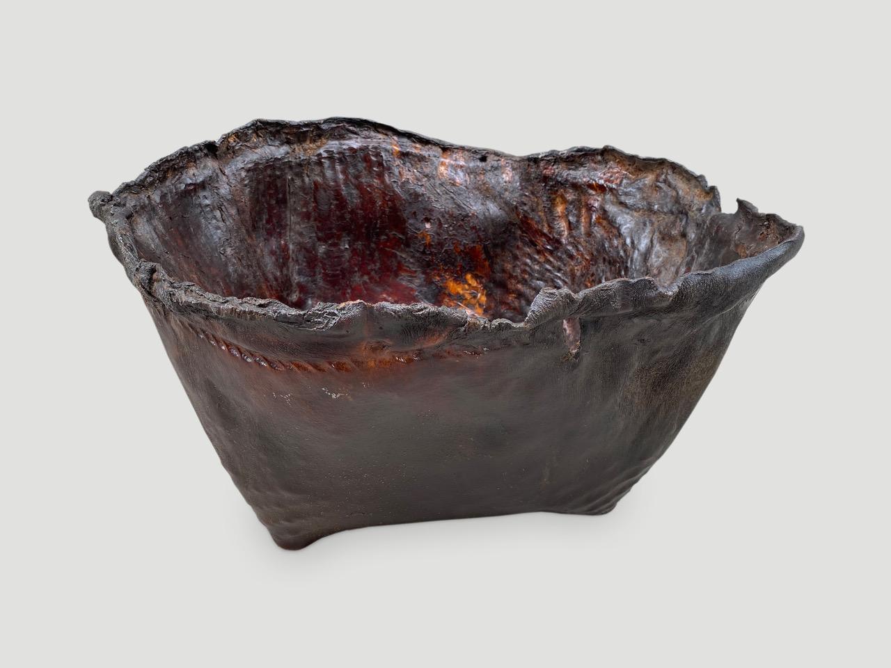 Antique container from Borneo made from aged buffalo hide with a natural organic live edge rim. We discovered a beautiful patina after polishing. Great for holding magazines, towels, or simply as a piece of art. We have a collection as shown in the