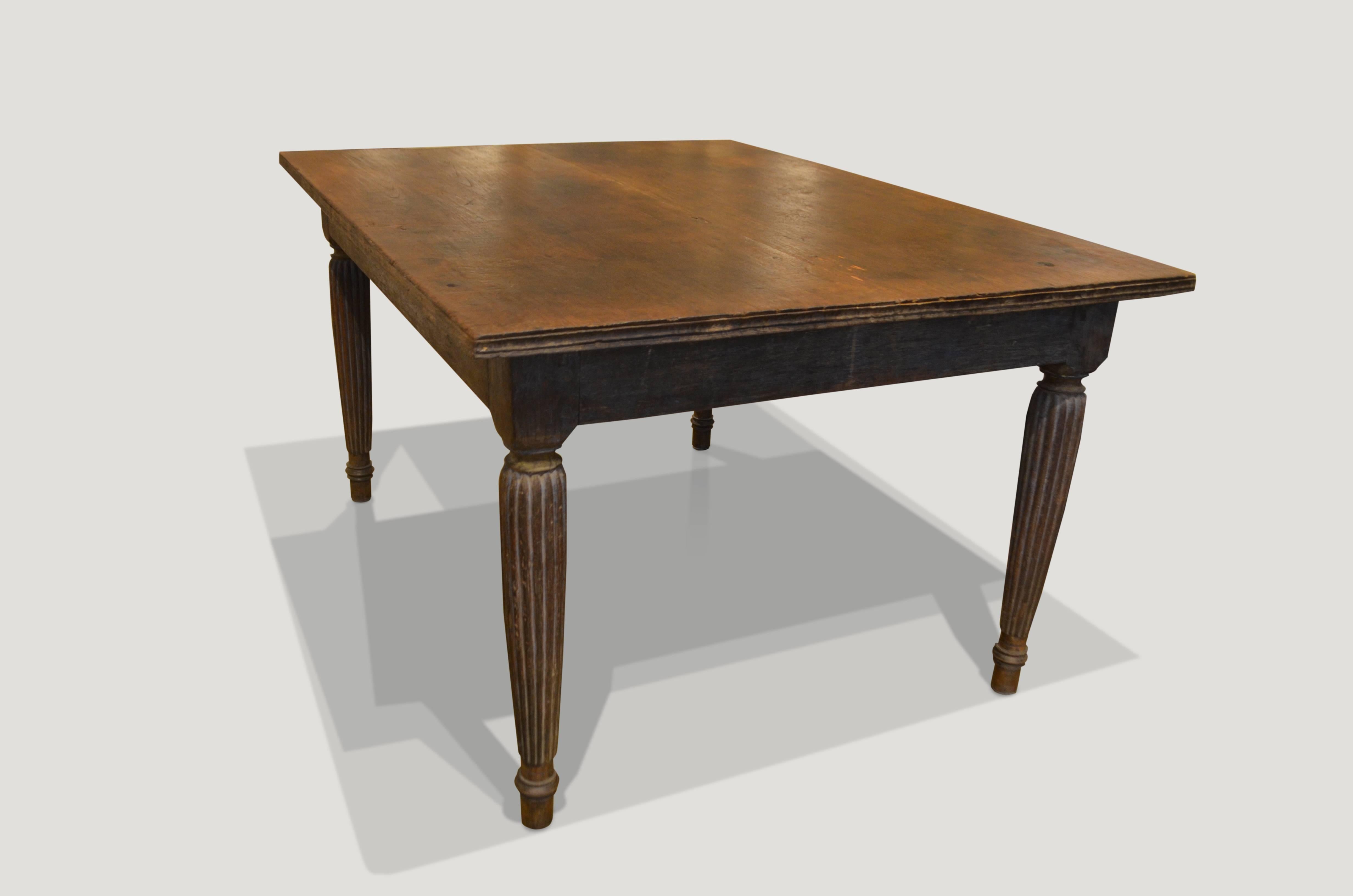 Antique teak dining table with a hand carved bevelled edge and hand carved legs with beautiful patina. Perfect as a dining table, entrance table or desk.

This table was sourced in the spirit of wabi-sabi a Japanese philosophy that beauty can be