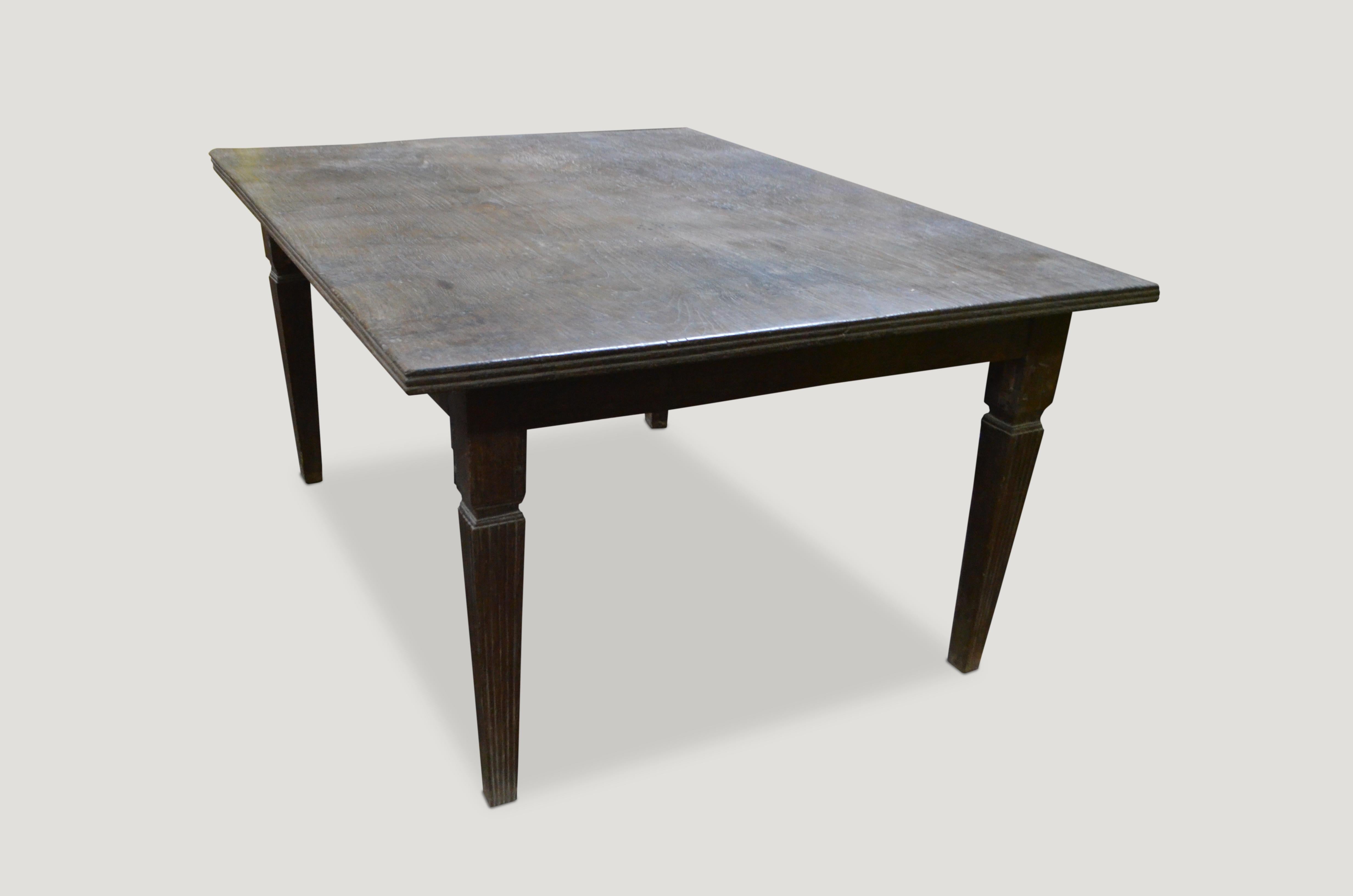 Stunning, rare, antique teak wood dining table with a hand carved bevelled edge and hand carved legs with beautiful patina. 

This table was sourced in the spirit of wabi-sabi a Japanese philosophy that beauty can be found in imperfection and