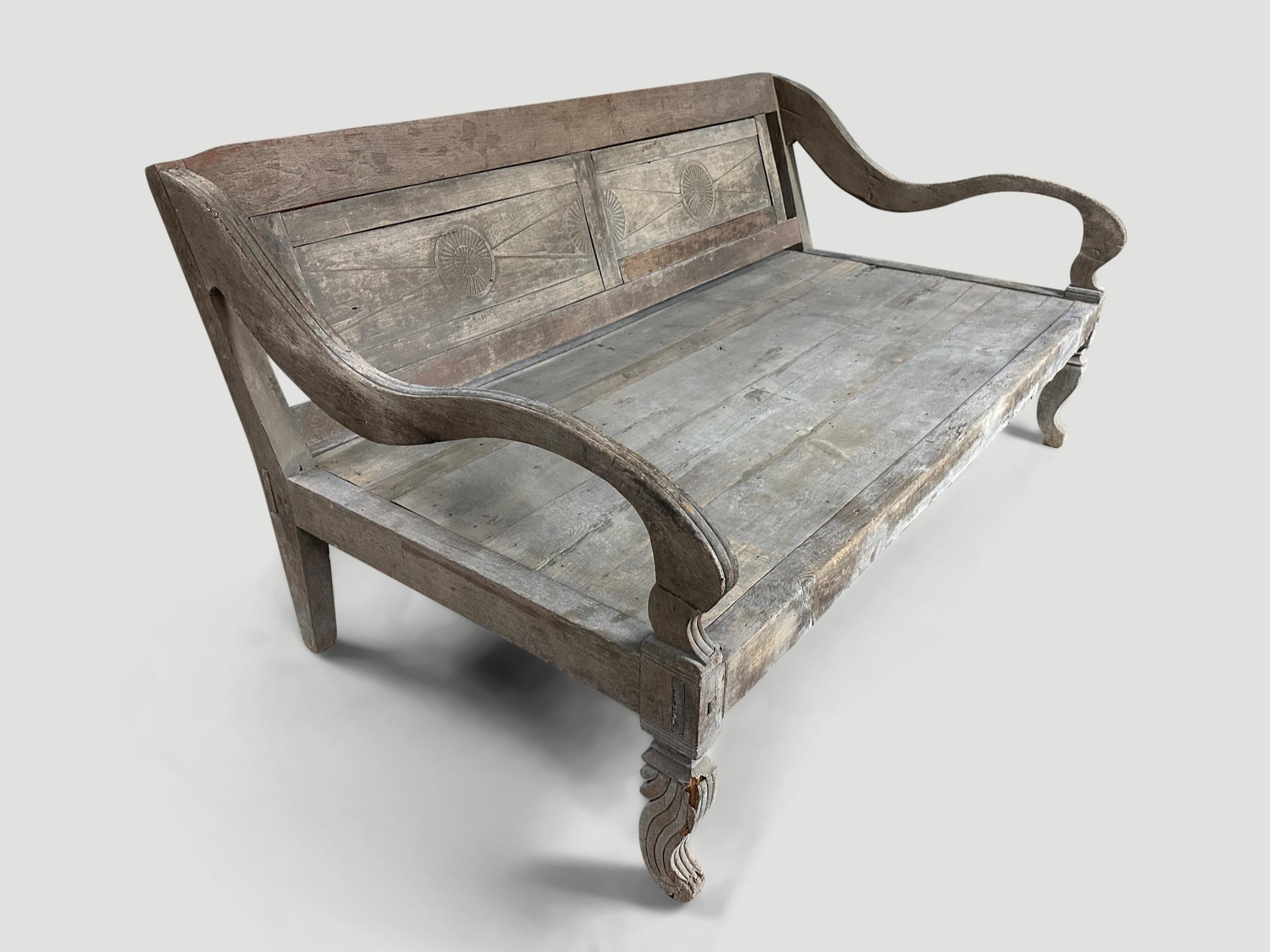 Rare antique teak day bed from the island of Madura. The patina on the wood is stunning. Circa 1900. The length of the arm is 46” and hand carved from one piece of wood. Taken from my finest collection and impossible to source now. The detail on the