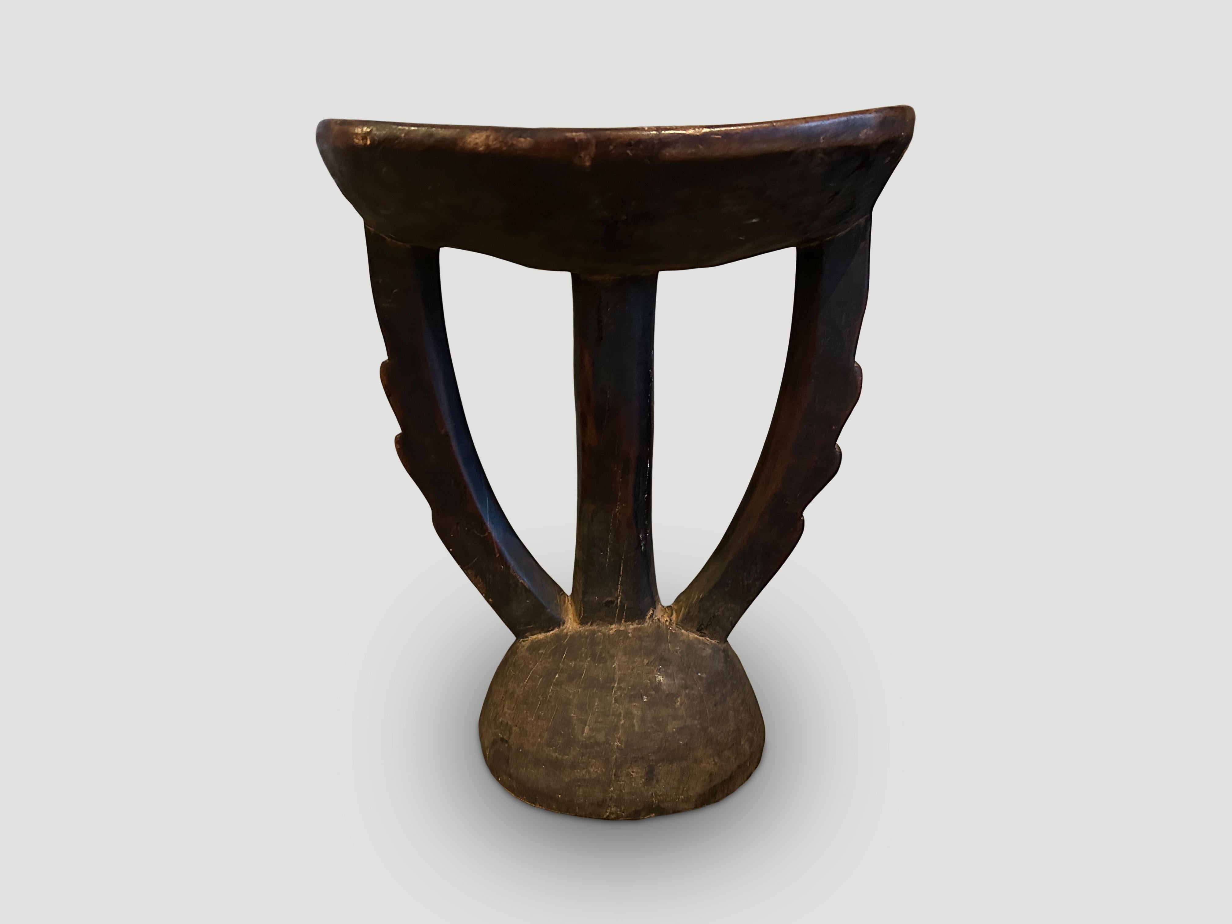 Beautiful African antique side table that is both usable and sculptural. Lovely patina on this unusual piece. The top is 13