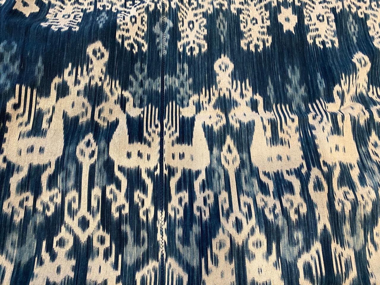 Beautiful soft indigo Ikat in pristine condition from Sumba. We added a bone leather to the edge on one side. This is fabulous on a sofa, bed or even to wear as a shawl.

Andrianna Shamaris. The Leader In Modern Organic Design.