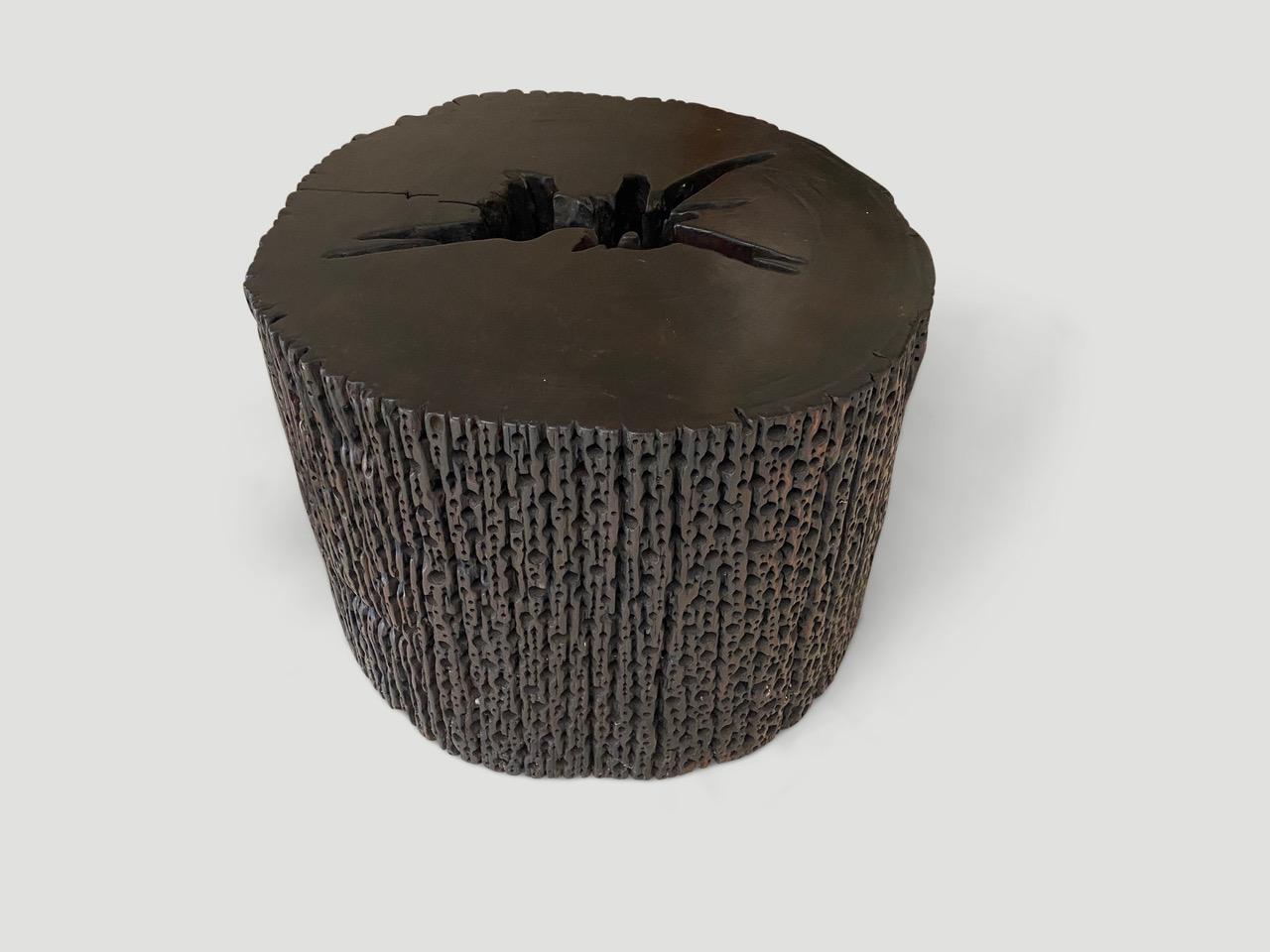 This century old iron wood log is transformed into a stunningly beautiful coffee table or side table. After years submerged beneath the sea, tiny holes have formed through a wholly natural and organic process. Captured and restored, it is a rare and