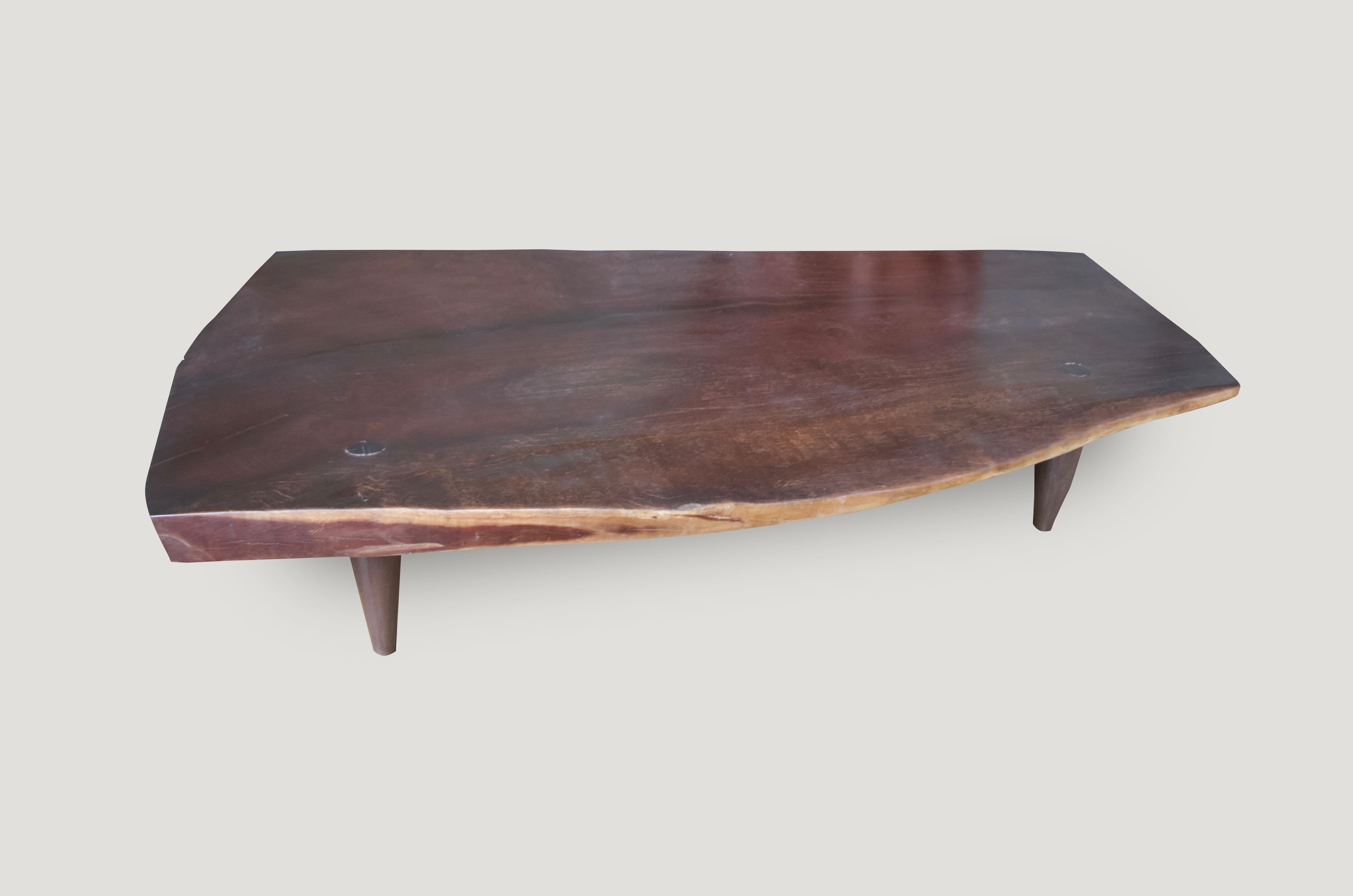Impressive museum quality, single three inch slab coffee table. We added midcentury style legs. We will never find wood like this again. This can also be stained/charred black if preferred. Rare.

Measures: 89 x 55-32” wide x 17”