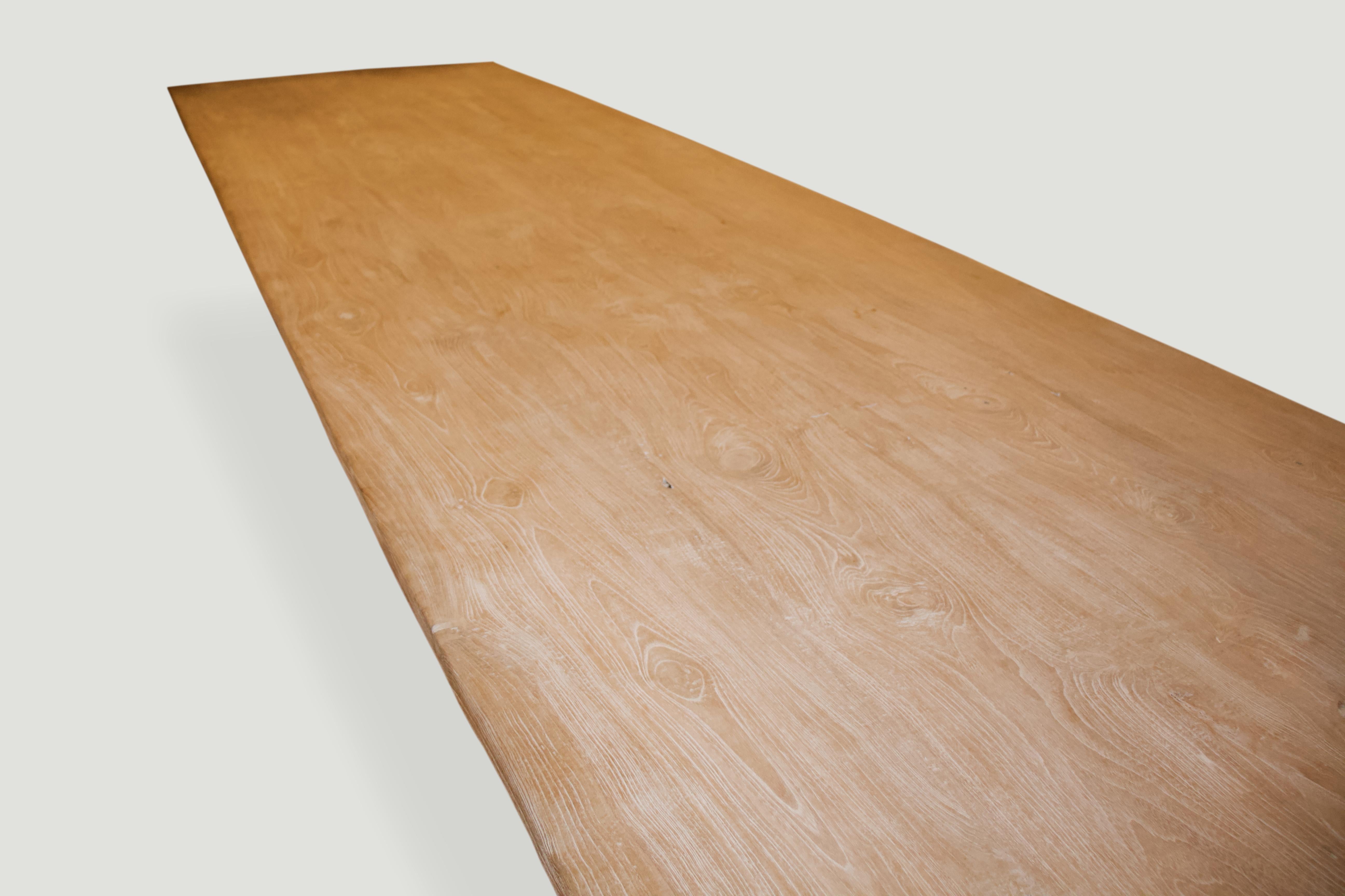 Reclaimed teak dining table comprising of four 1.5″ slabs joined. We added a light white wash finish allowing the grain of the teak wood to show. Floating on a 3” thick base. Custom stains available.

The St. Barts Collection features an exciting