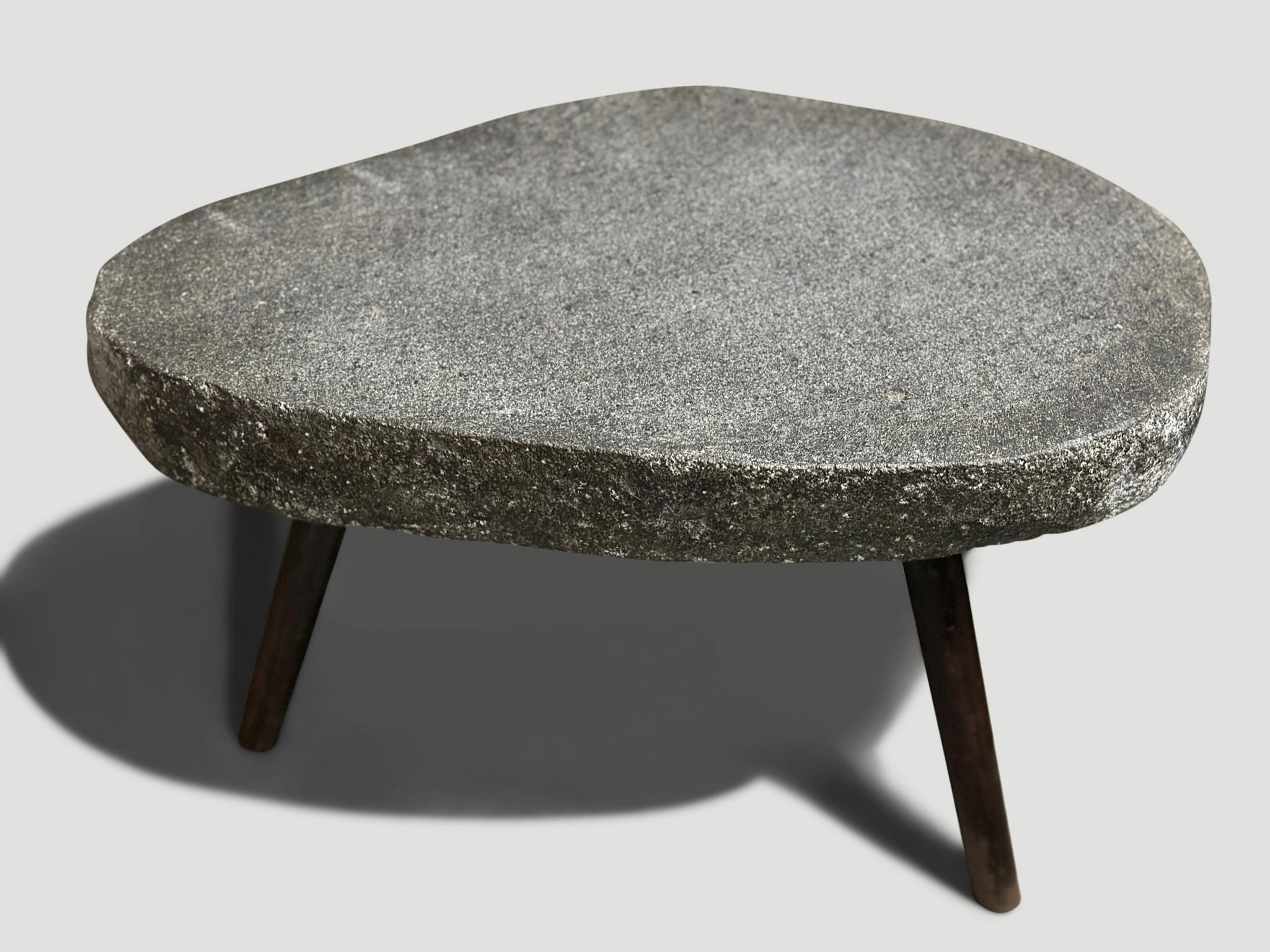 River stone side table from the Ayung River on the island of Bali. We added charred metal legs and polished the 3.5”  top smooth. The sides are left unpolished in contrast. Perfect for poolside. Collection of ten available. All one of a kind. Please