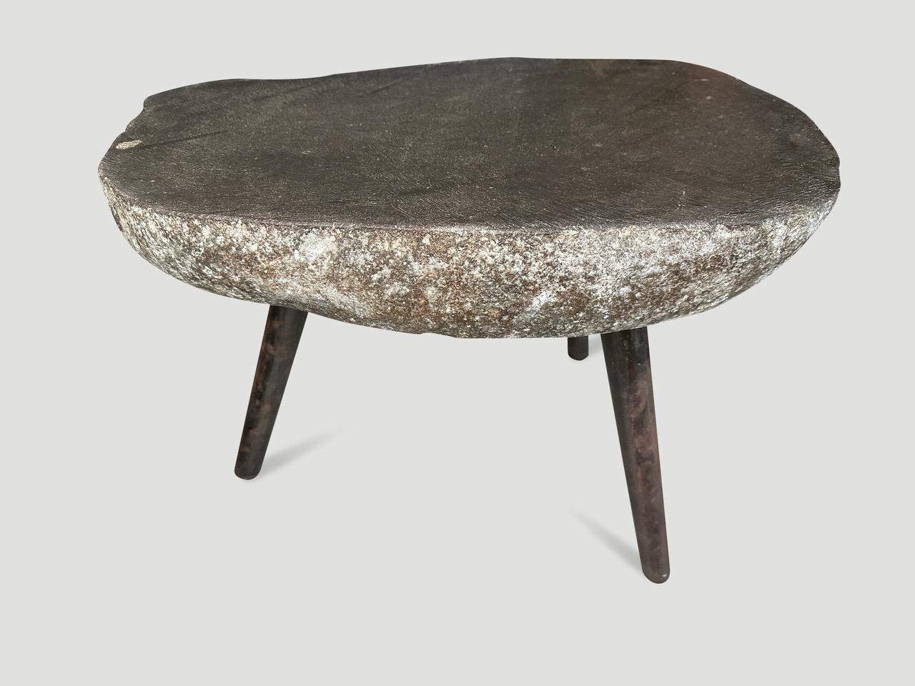 River stone side table from the Ayung River on the island of Bali. We added charred metal legs and polished the top. The sides are left unpolished in contrast. Perfect for poolside. Collection available. All one of a kind. Please inquire. The images
