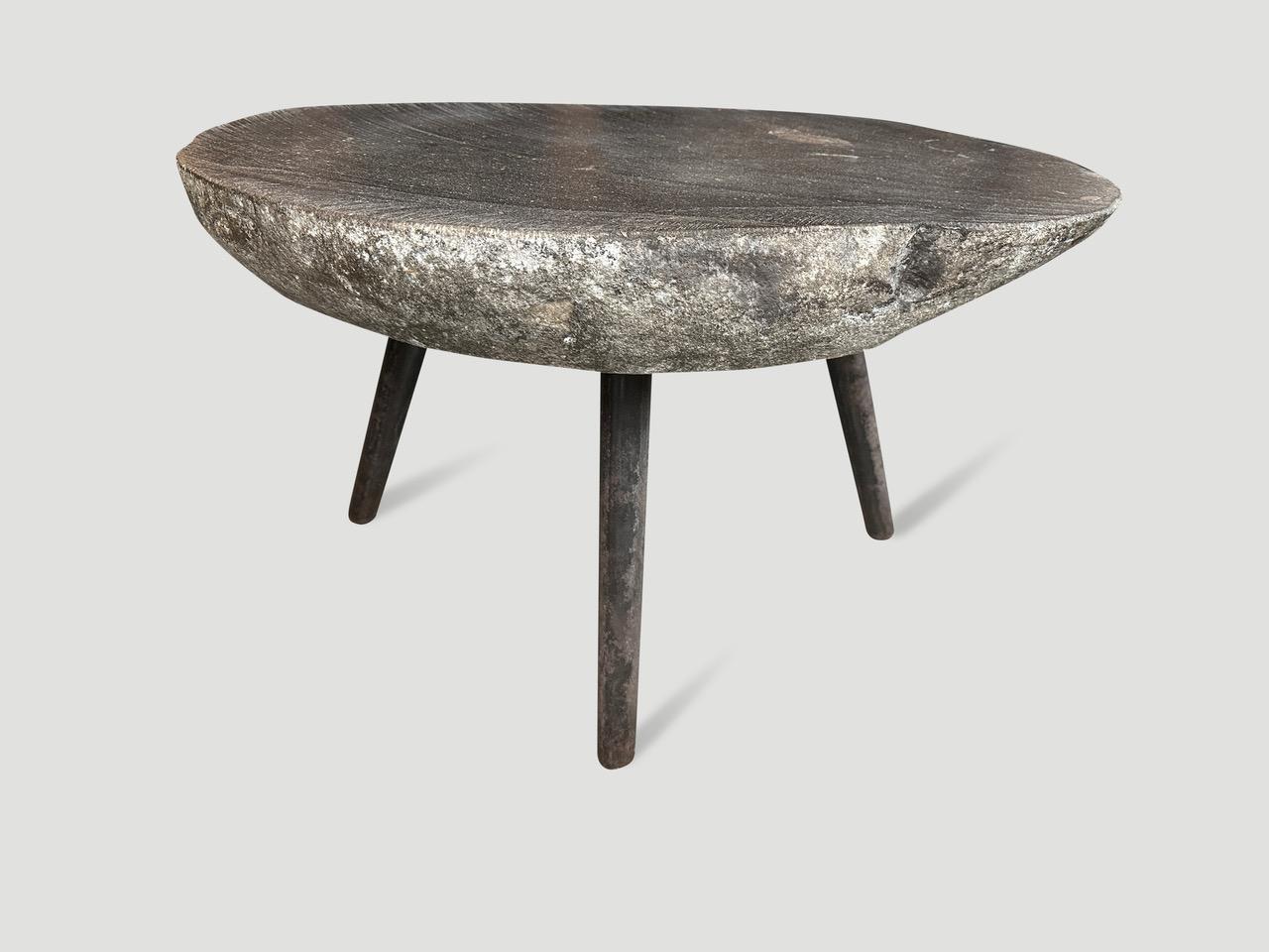 River stone side table from the Ayung River on the island of Bali. We added charred metal legs and polished the top. The sides are left unpolished in contrast. Perfect for poolside. Collection available. All one of a kind. Please inquire. The images