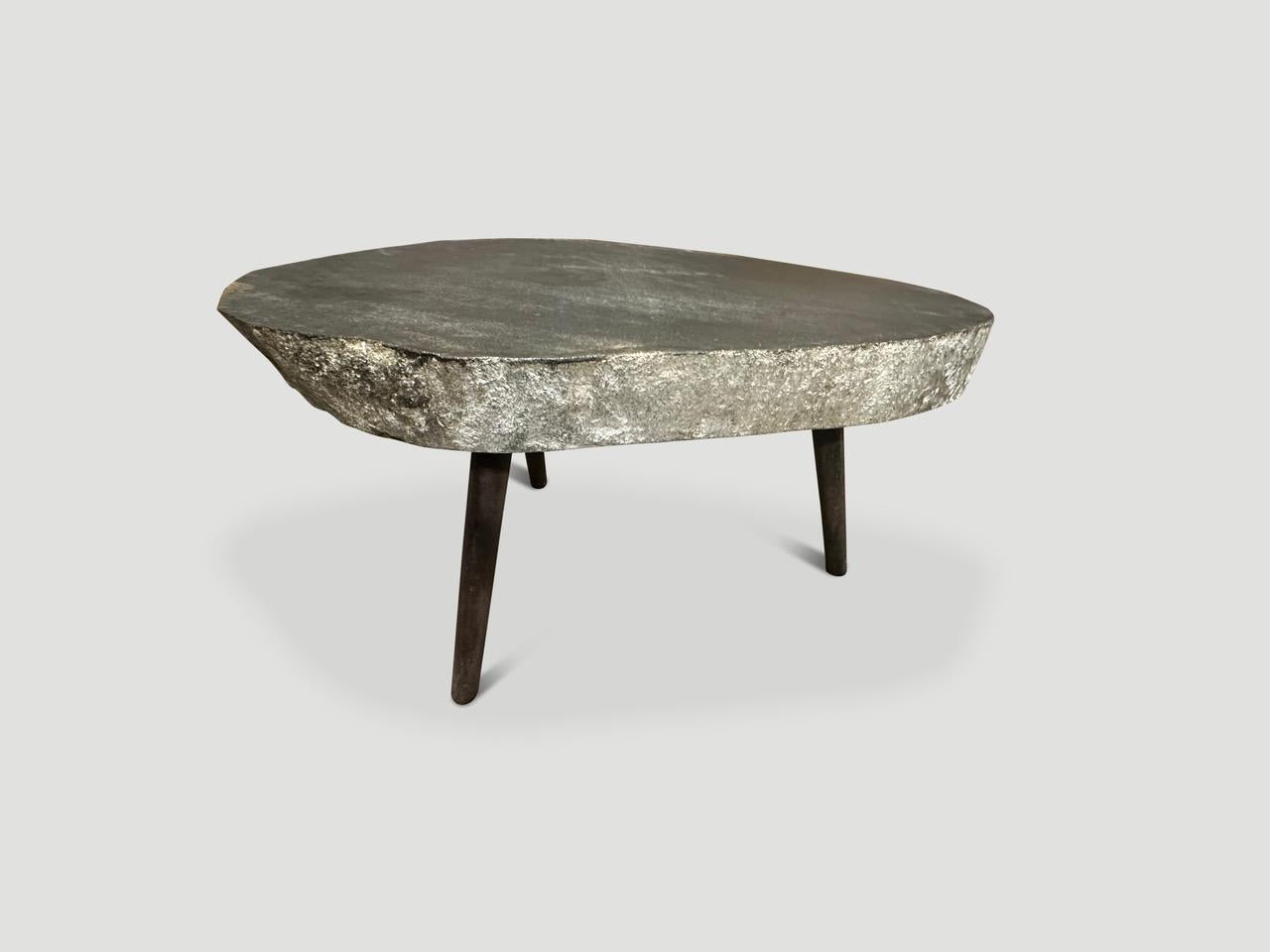 River stone side table from the Ayung River on the island of Bali. We added three charred metal legs and polished the top. The sides are left unpolished in contrast. Perfect for poolside.

Own an Andrianna Shamaris original.

Andrianna Shamaris. The