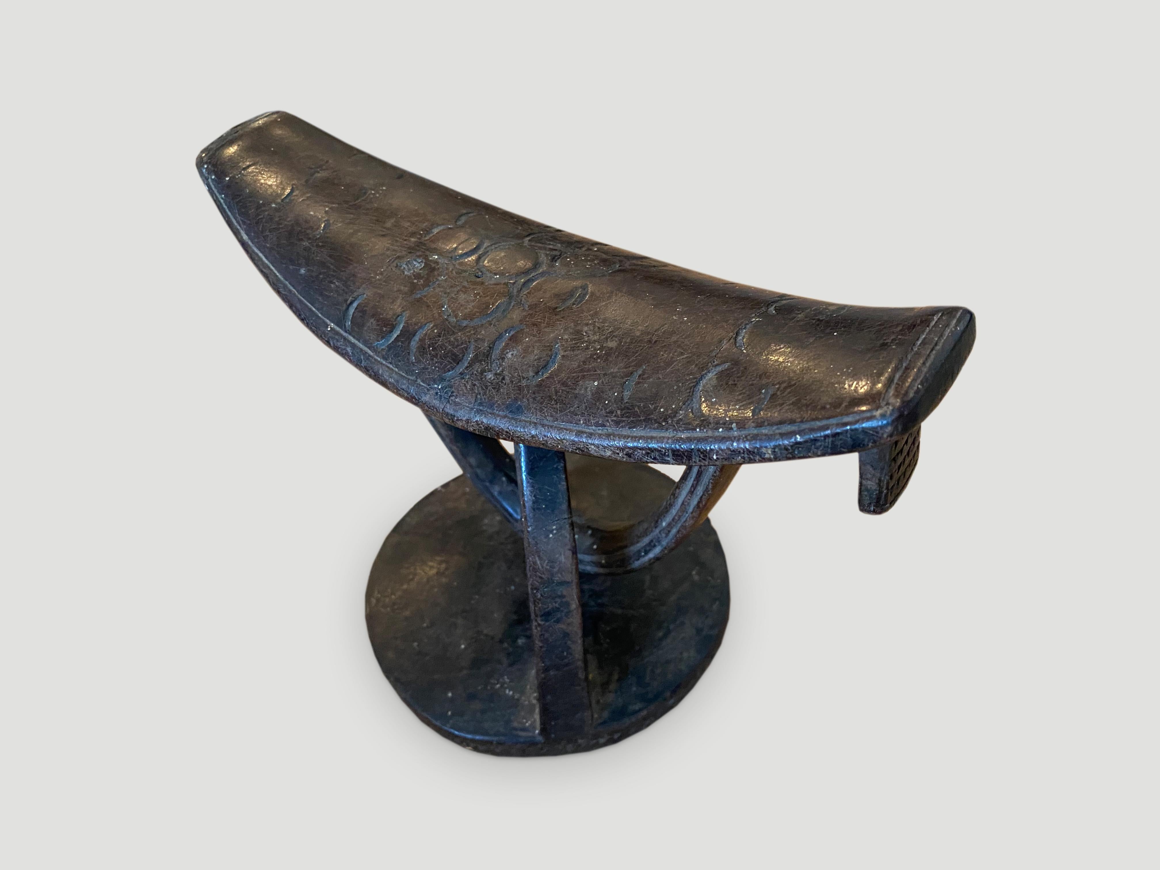 Rare. Beautiful museum quality hand carved wooden head rest. Stunning patina on this unusual head rest that rotates. Circa 1900.

This head rest was sourced in the spirit of wabi-sabi, a Japanese philosophy that beauty can be found in imperfection