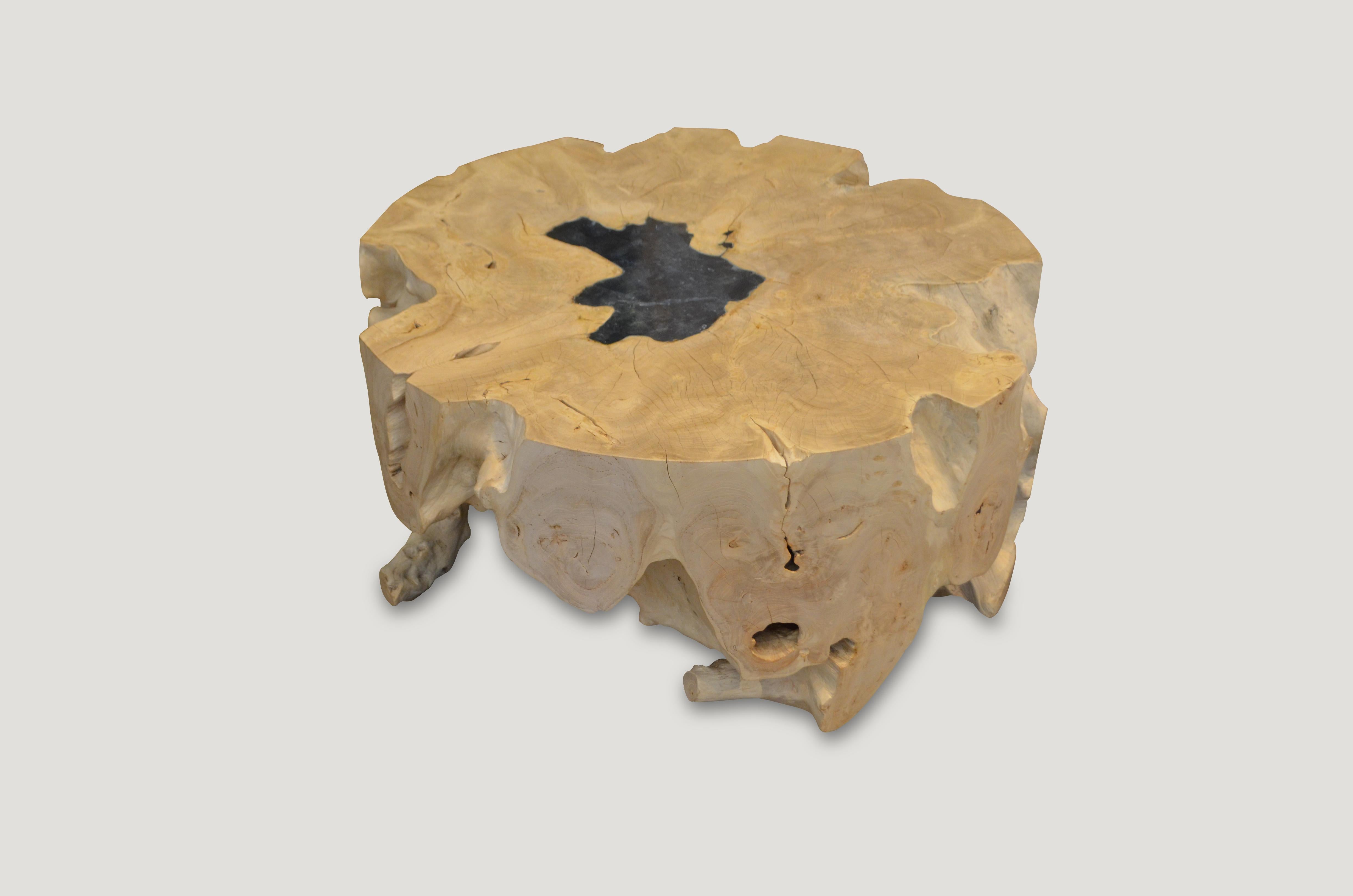 Impressive single root coffee table, hand carved into this round shape. We have added ice blue cracked resin to the top.

The St. Barts Collection features an exciting new line of organic white wash and natural weathered teak furniture. The