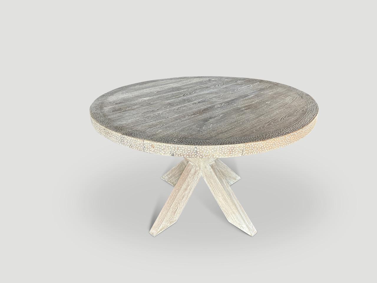 Impressive reclaimed teak wood dining table or entrance table. We added hand cut shell inlay on the top section and the side plus a secret ingredient to lighten the wood tone. Floating on a minimalist cross base. Custom styles and sizes available.