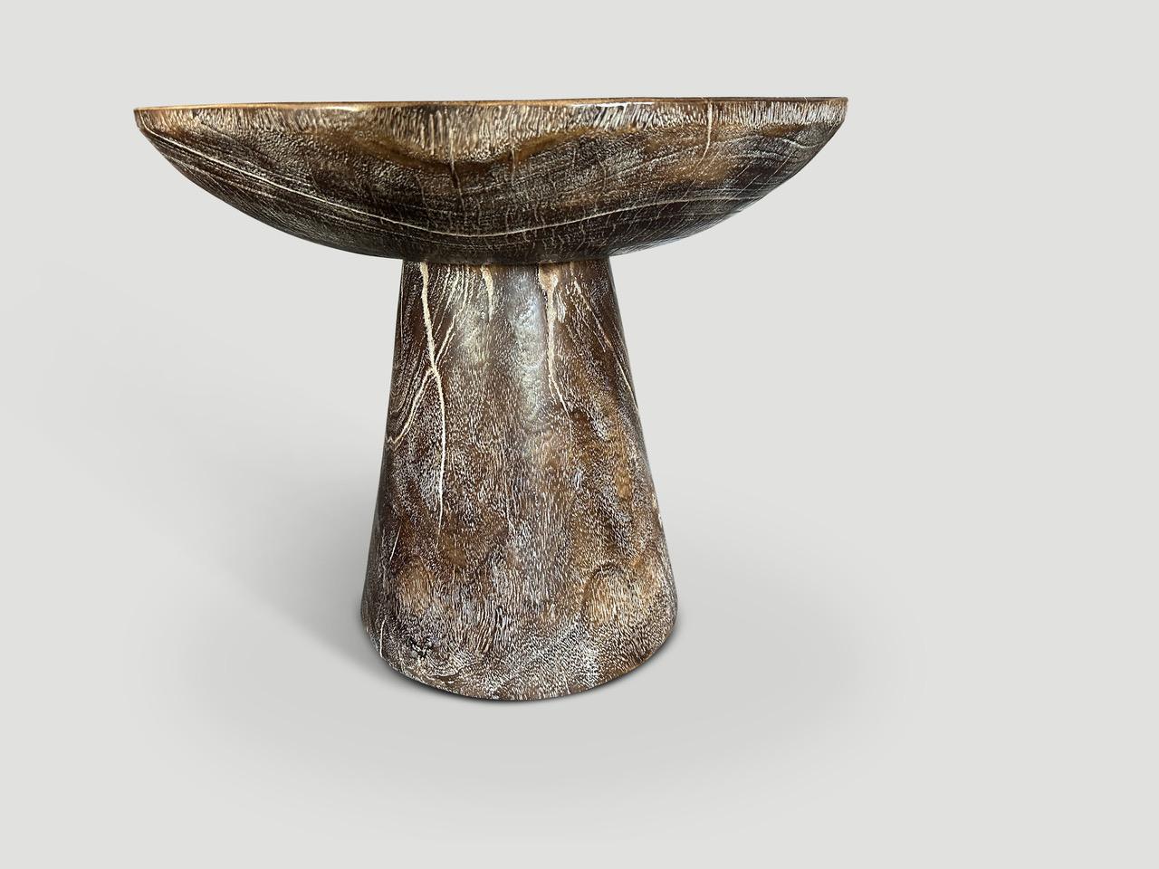 We took a thick slab of mango wood and hand carved a deep bevel to produce this unique side table with a cylinder base. Single charred to a chocolate stain with a ceruse revealing the beautiful wood grain. It’s all in the details.

The Triple Burnt