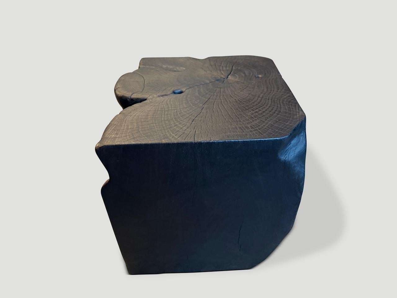 Sculptural teak wood side table hand carved whilst respecting the natural organic wood. Charred, sanded and sealed revealing the beautiful wood grain. It’s all in the details.

The Triple Burnt Collection represents a unique line of modern furniture