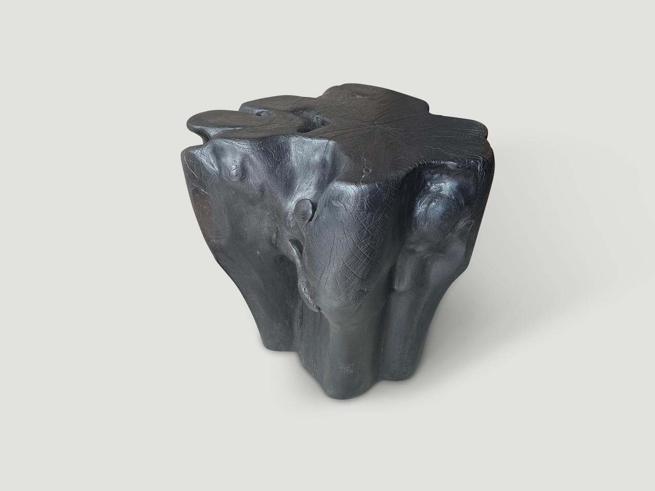 Beautiful organic reclaimed teak wood side table or pedestal. A graduation from the bottom to the top. Charred, sanded and sealed revealing the beautiful wood grain. Both sculptural and usable.

The Triple Burnt Collection represents a unique line
