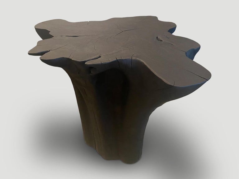 Beautiful amorphous reclaimed teak side table or pedestal. A dramatic graduation from the bottom to the top. Charred, sanded and sealed revealing the beautiful wood grain. Both sculptural and usable. We have a collection. The price and images