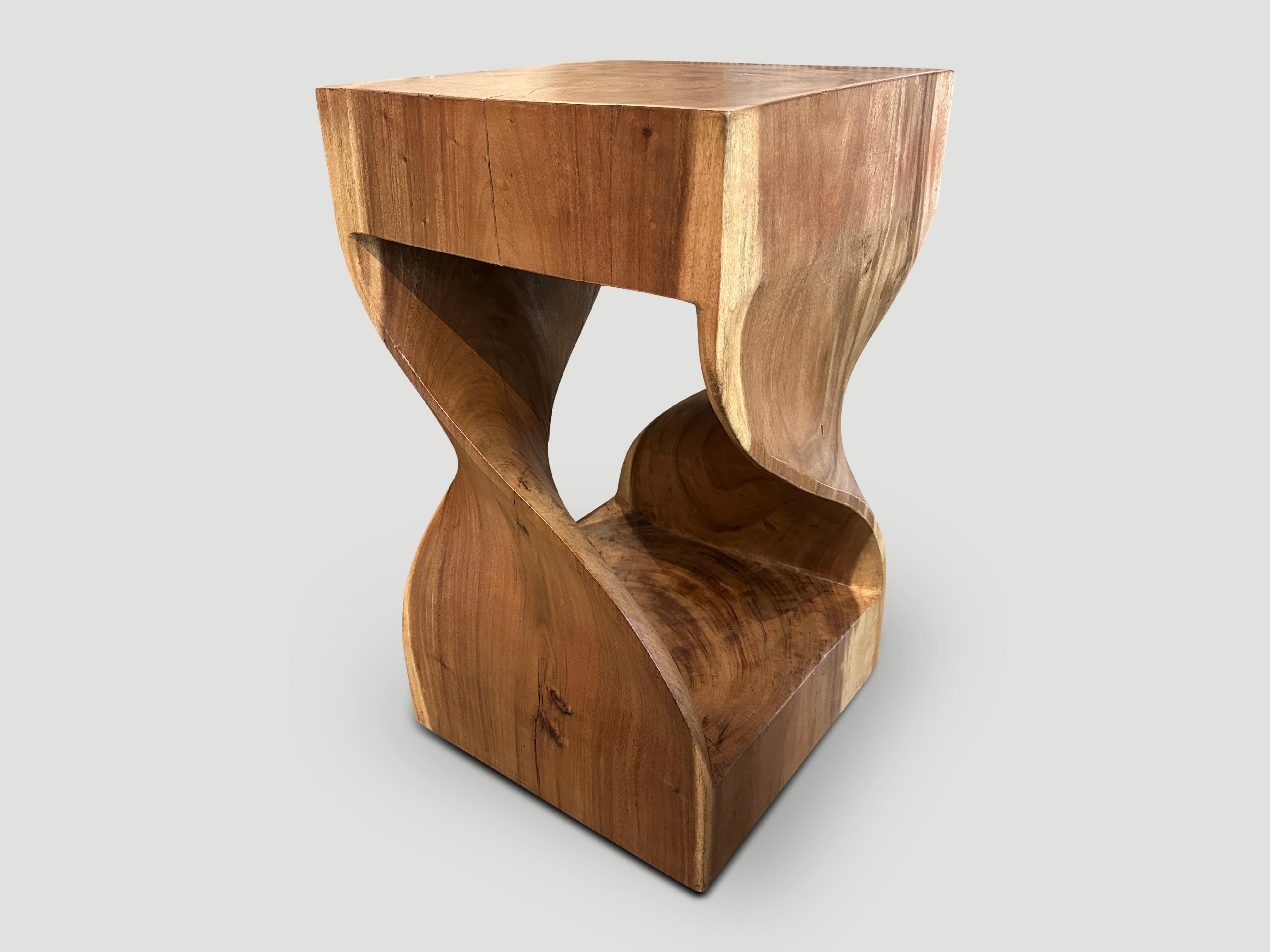Impressive reclaimed suar wood pedestal. Hand carved into this stunning shape from a single block of wood. Finished with a natural oil revealing the beautiful contrasting wood grain. Both usable and sculptural. Pair available. The price reflects