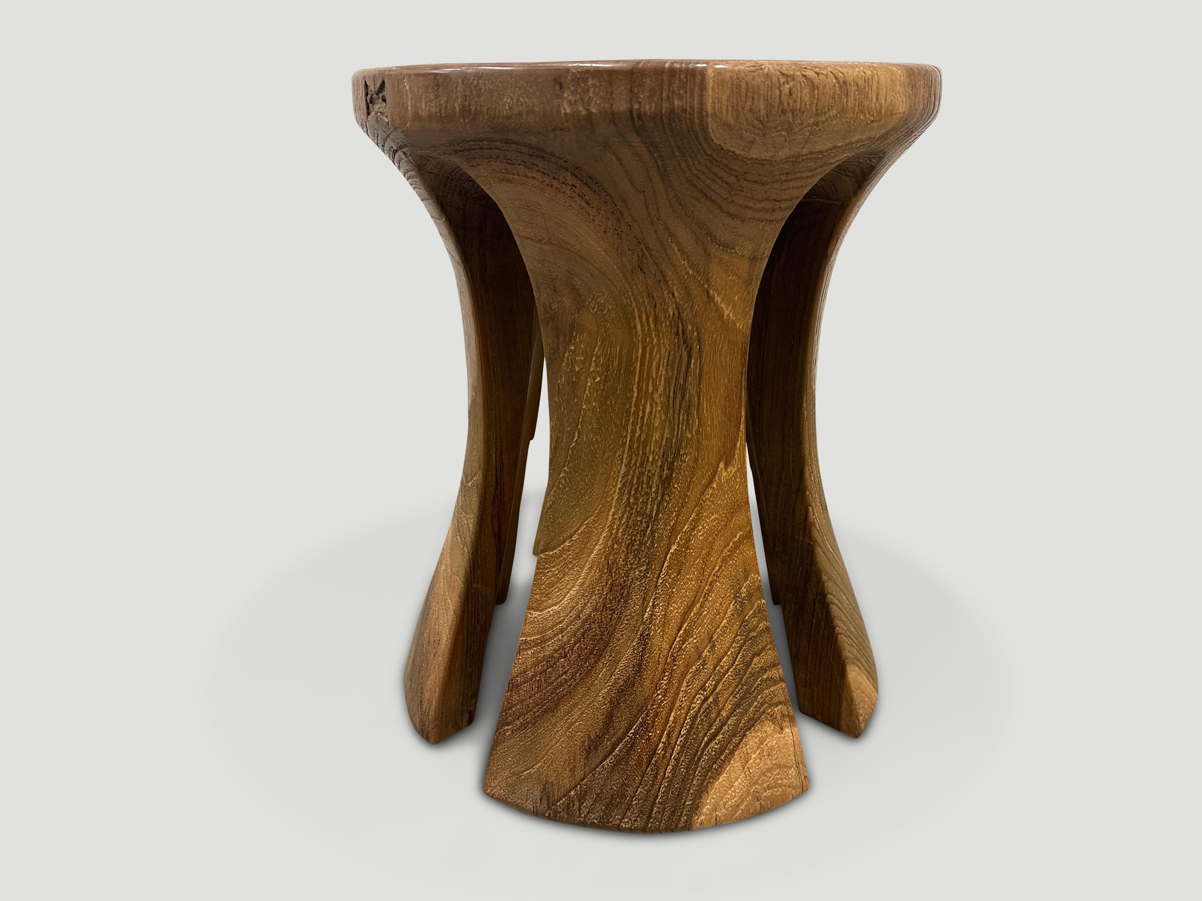 A century old teak wood mortar originally used to grind rice, is repurposed into this minimalist side table or stool. Part of the Mid Century Couture Collection, we first turned this ancient piece upside down and smoothed it out entirely and then