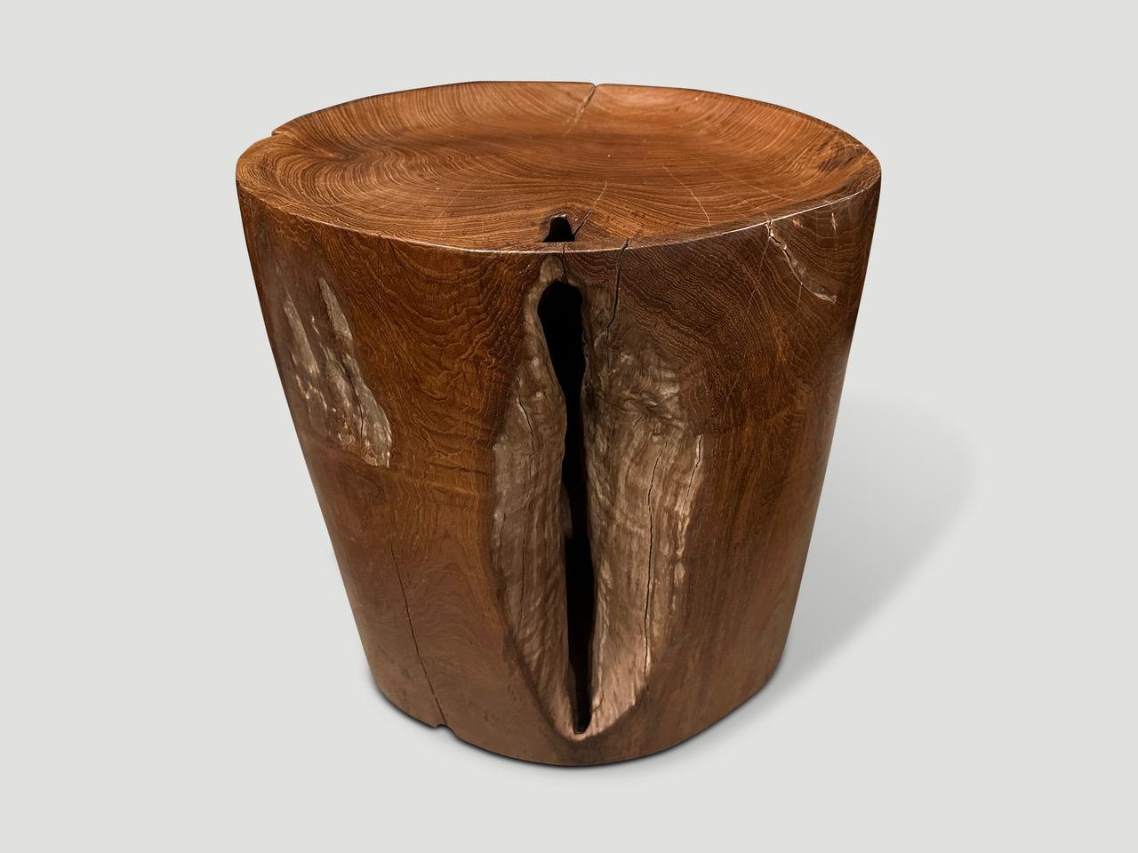 Natural organic formed reclaimed teak root side table. We hand carved the top section into a tray style and polished the aged teak with a natural oil revealing the beautiful wood grain. The inner sections are sanded and left unpolished in contrast.