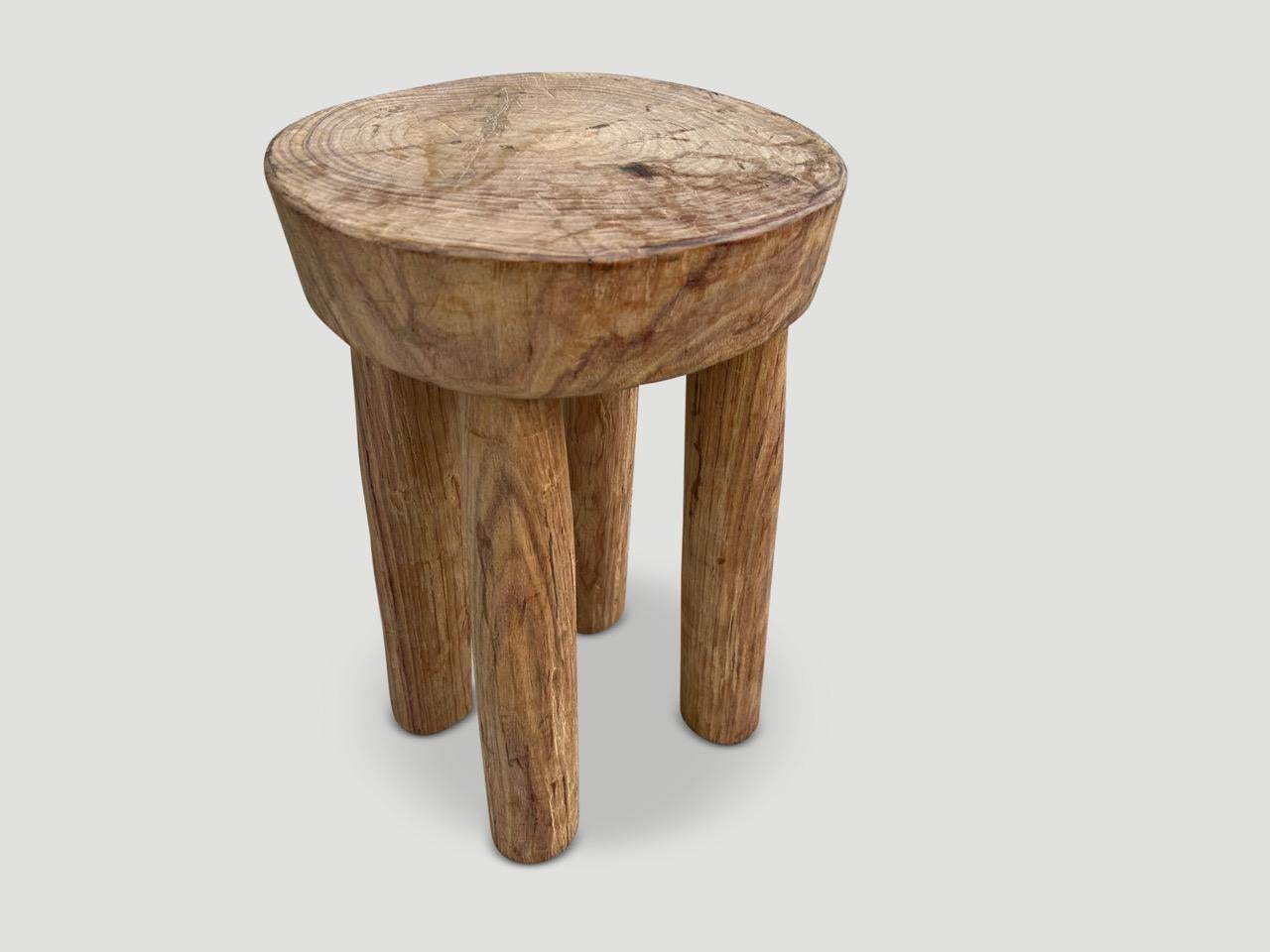 Beautiful antique side table or stool hand carved by the Senufo tribes from a single block of mahogany wood native to the west coast of Africa. The wood is tough, dense and very durable. The light tone wood on this one is unusual as they are mostly