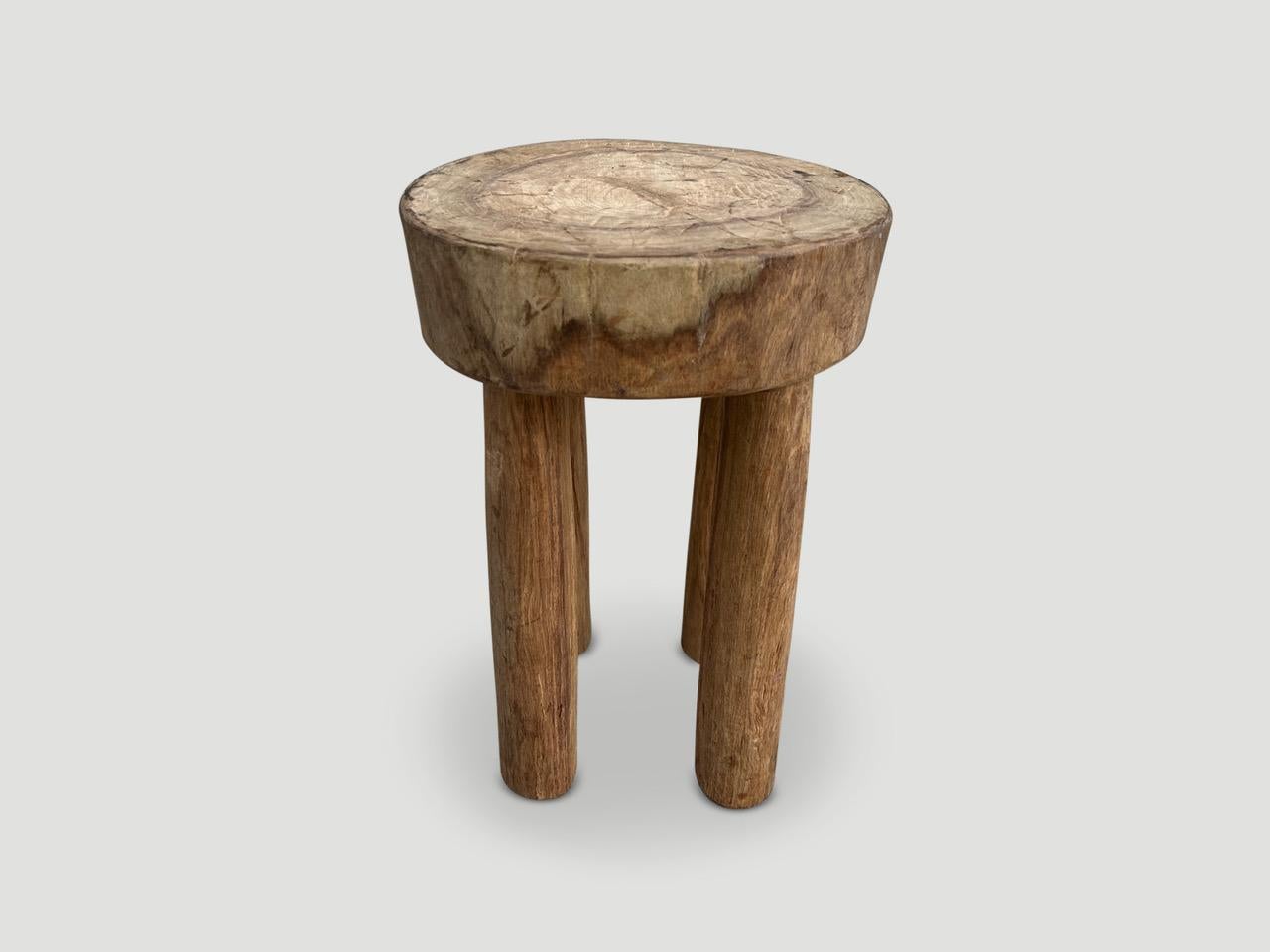 Beautiful antique side table or stool hand carved by the Senufo tribes from a single block of mahogany wood native to the west coast of Africa. The wood is tough, dense and very durable. The light tone wood on this one is unusual as they are mostly