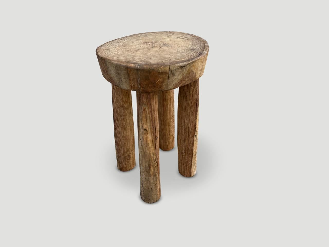 Beautiful antique side table or stool hand carved by the Senufo tribes from a single block of mahogany wood native to the west coast of Africa. The wood is tough, dense and very durable. The light tone wood is unusual as they are mostly darker.