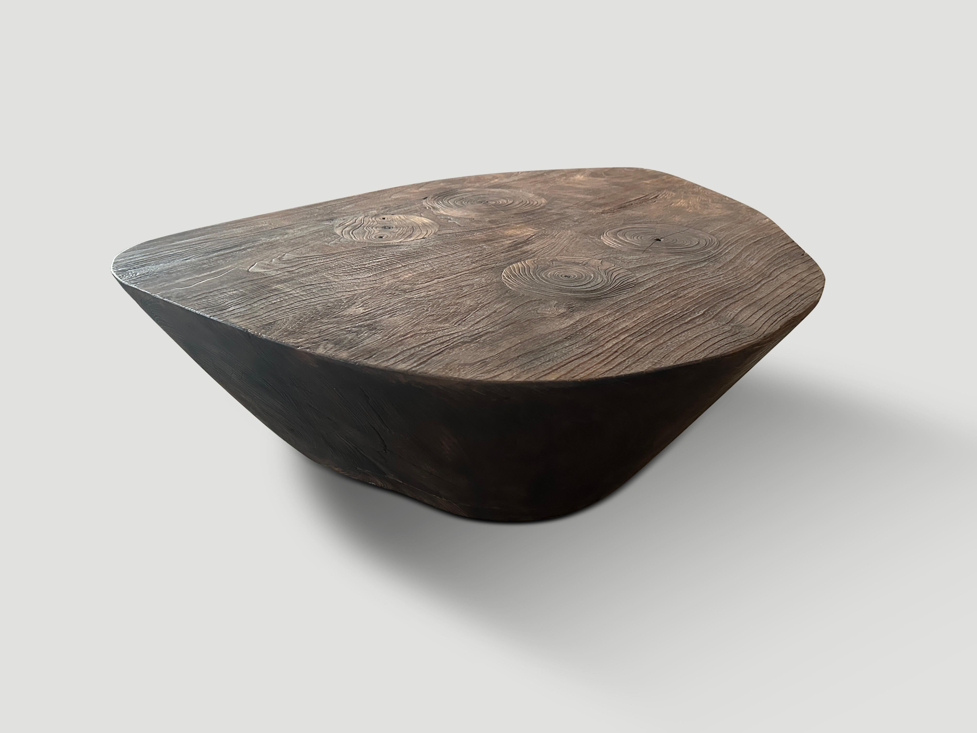 Beautiful reclaimed teak wood minimalist coffee table. Charred one time revealing the unique wood grain. Hand carved with a dramatic graduation from the bottom to the top. Both sculptural and usable. It’s all in the details. 

The Triple Burnt