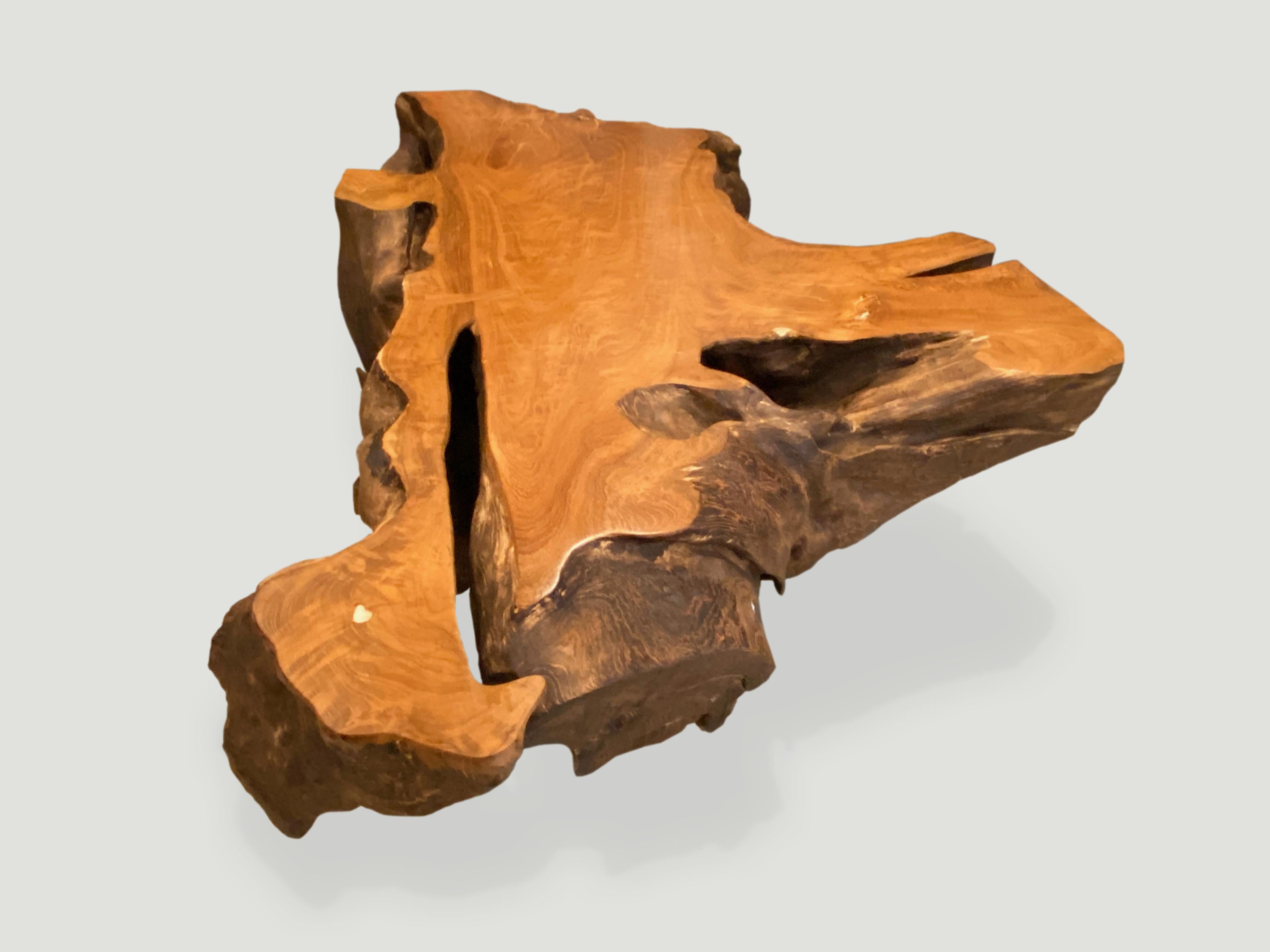 Impressive reclaimed teak root coffee table with butterfly detail. We hammered the sides and finish with a light charring and left the top section smooth and polished in contrast. Perfect for inside or outside living.

Andrianna Shamaris. The