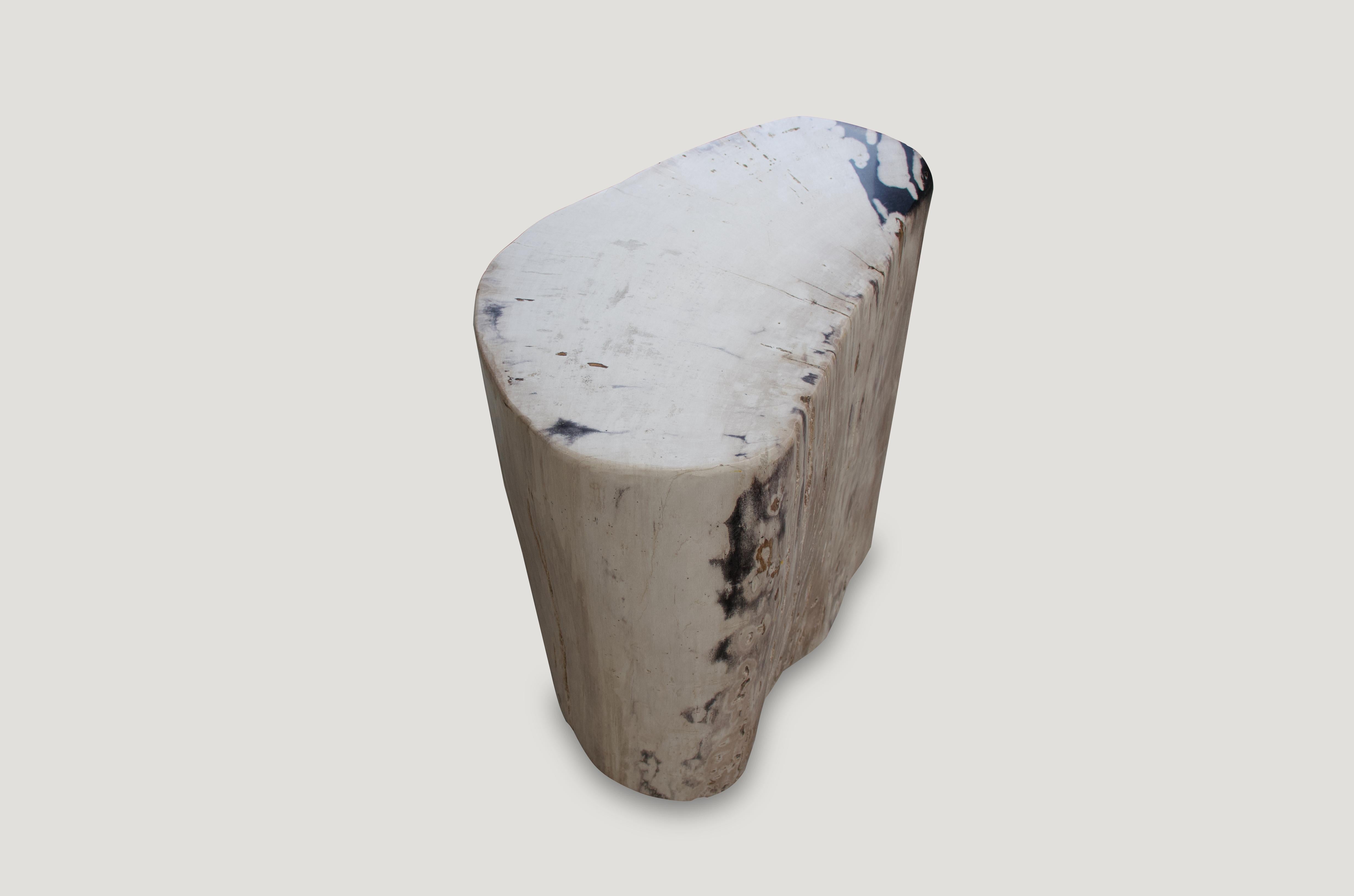 Stunning, hard to find soft pale tones on this super smooth, high quality petrified wood side table.

As with a diamond, we polish the highest quality fossilized petrified wood, using our latest ground breaking technology, to reveal its natural