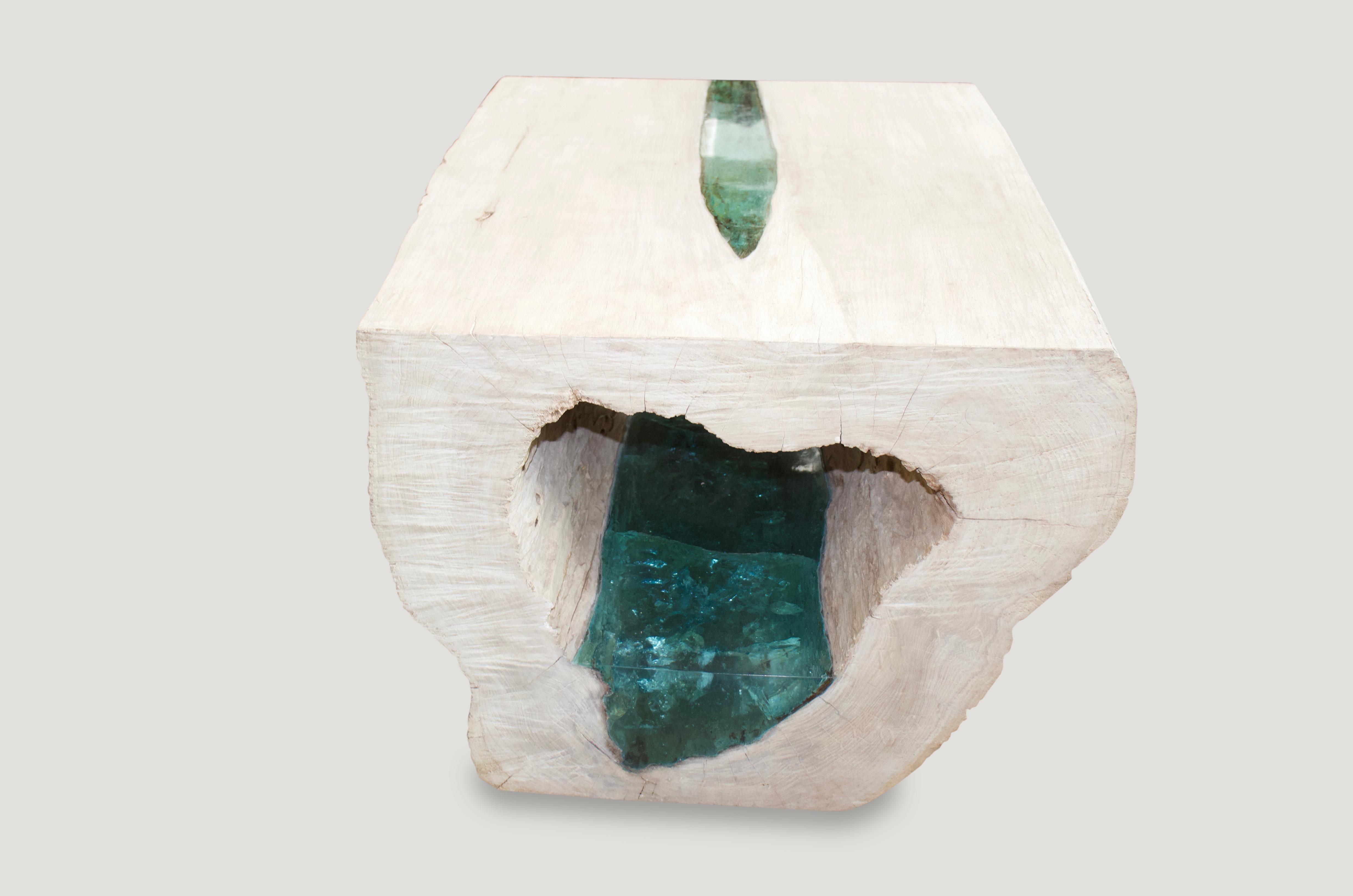 Reclaimed bleached teak wood hollowed out log. We turned this into a coffee table with a light white washed finish and finally added the stunning emerald green resin. Organic is the new modern.

The St. Barts collection features an exciting new