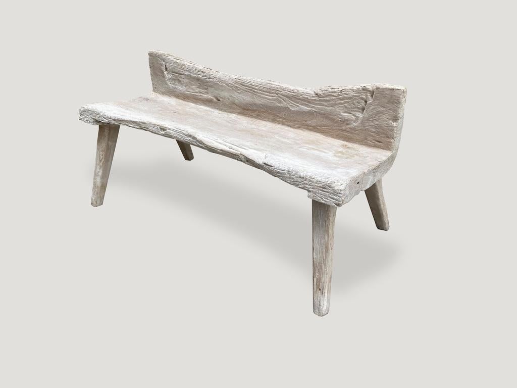 Beautiful teak bench. The seat and back rest are hand carved out of one piece of solid thick teak. Fabulous lines and erosion on the wood. 

The St. Barts Collection features an exciting new line of organic bleached, white wash and natural