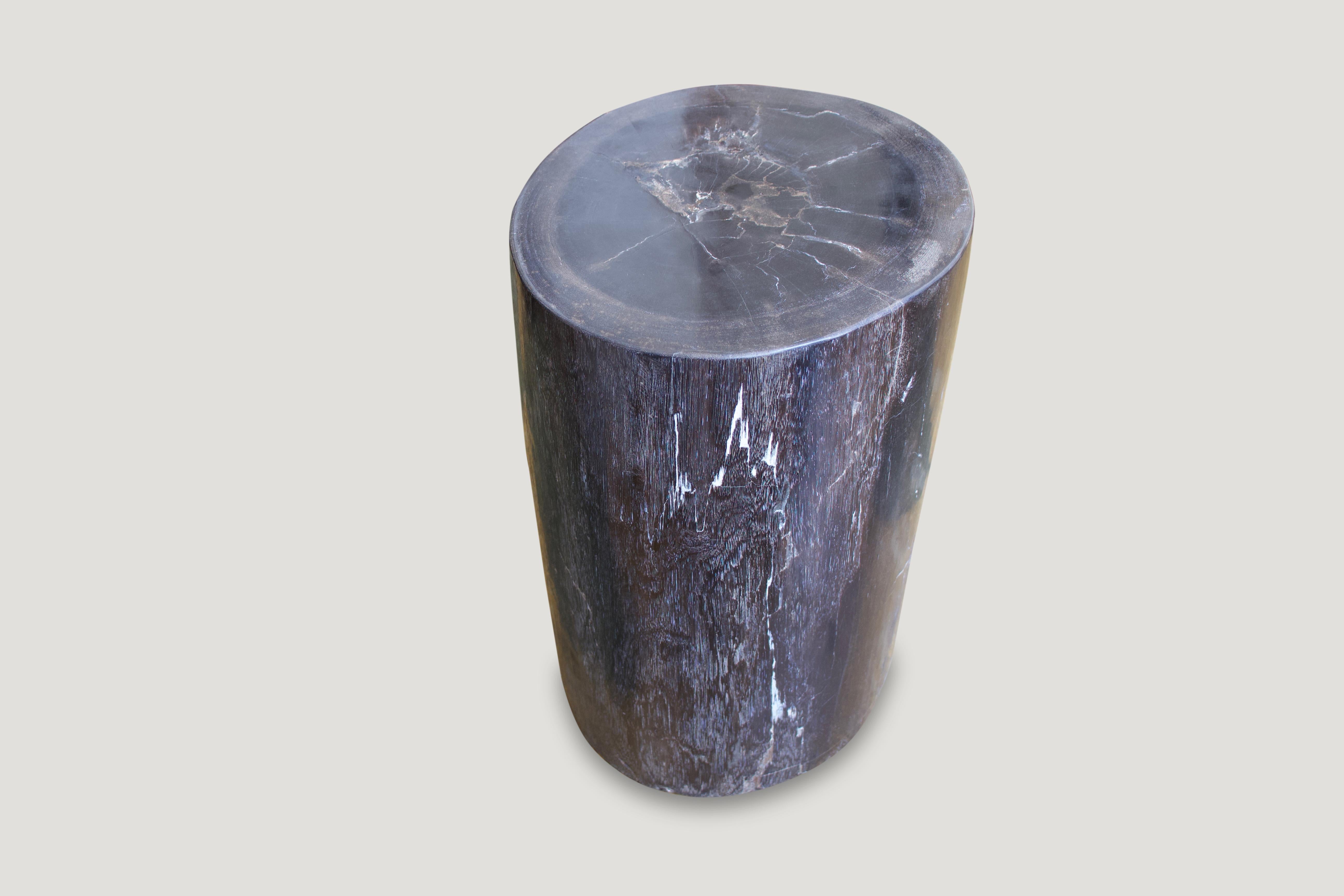 Classic dark tones with a dash of white in this fabulous high quality petrified wood side table. We have a pair available cut from the same petrified log. The images are for the one shown and the price reflects one.

We source the highest quality