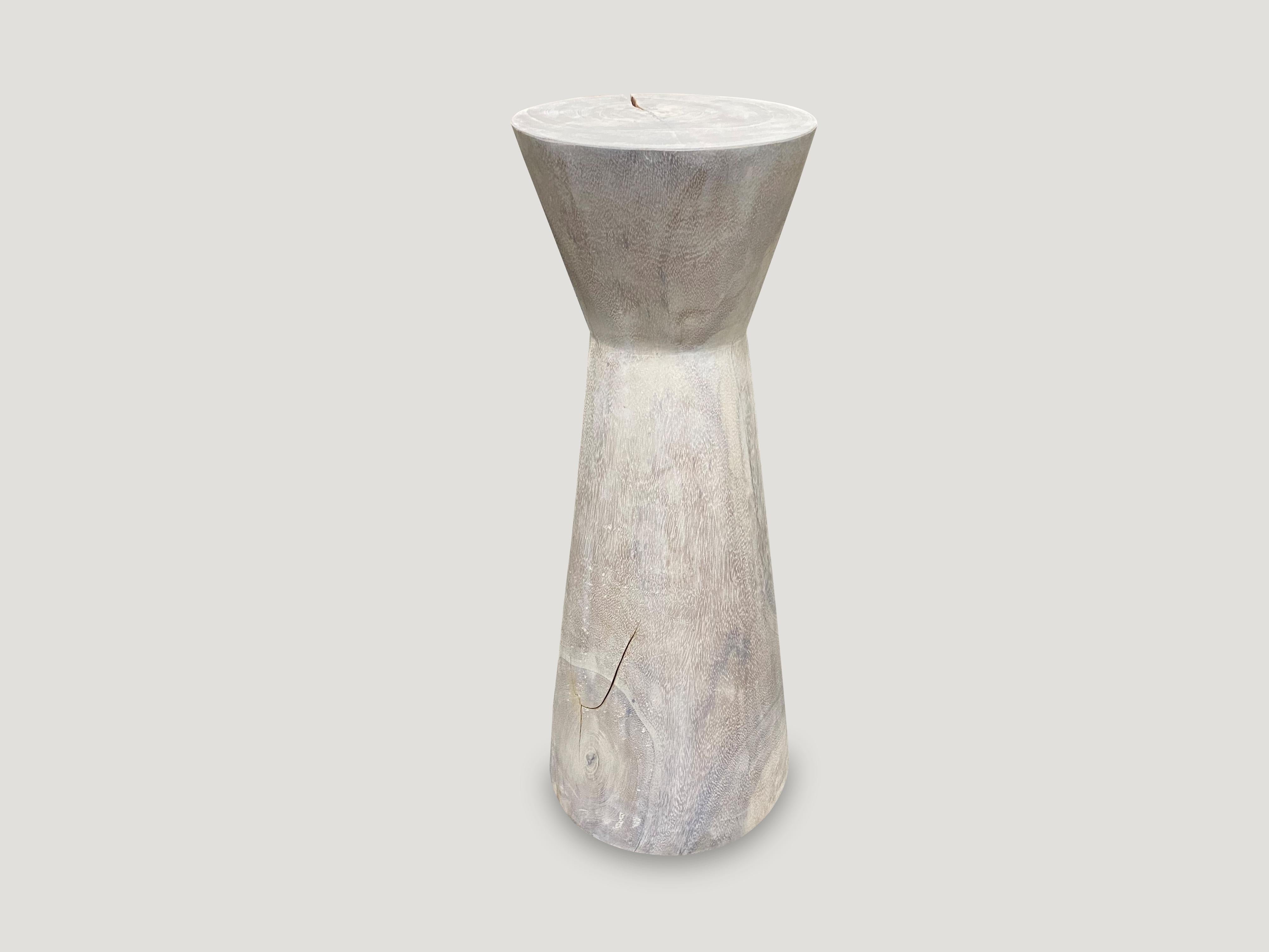 Beautiful hourglass tall side table made from solid suar wood. The bottom is 11” diameter and the top 9.5” diameter. The price reflects the one shown.

The St. Barts Collection features an exciting new line of organic white wash, bleached and