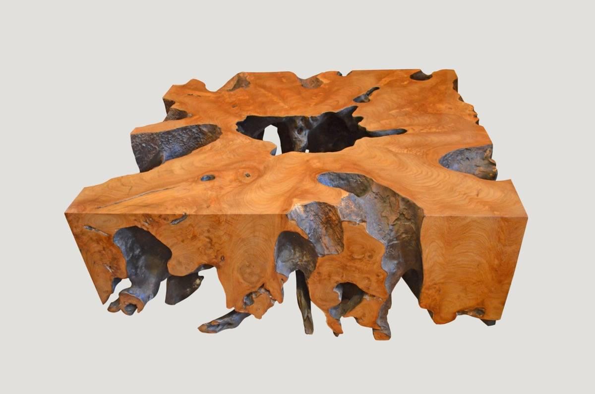 Impressive single reclaimed teak root coffee table. We have burnt the inside section one time and added a hammered finish. In contrast, the outer section is left natural teak with a smooth high polish. Organic is the new modern.

Andrianna