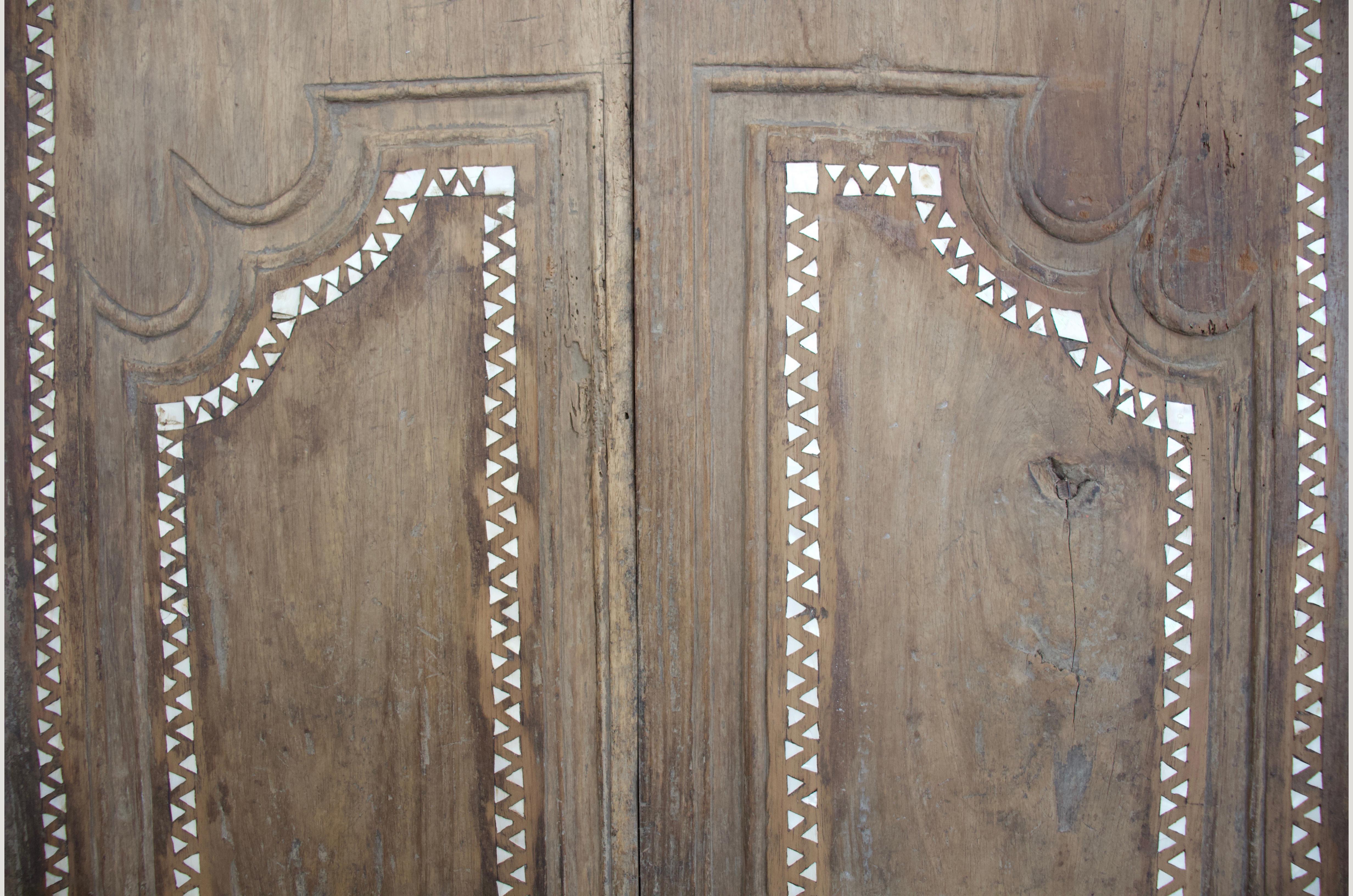 Antique temple doors in teak wood. We added the shell inlay by hand. Great as a headboard or coffee table. We currently have a large collection of temple doors available. All unique with added shell inlay, setting these apart from standard antique
