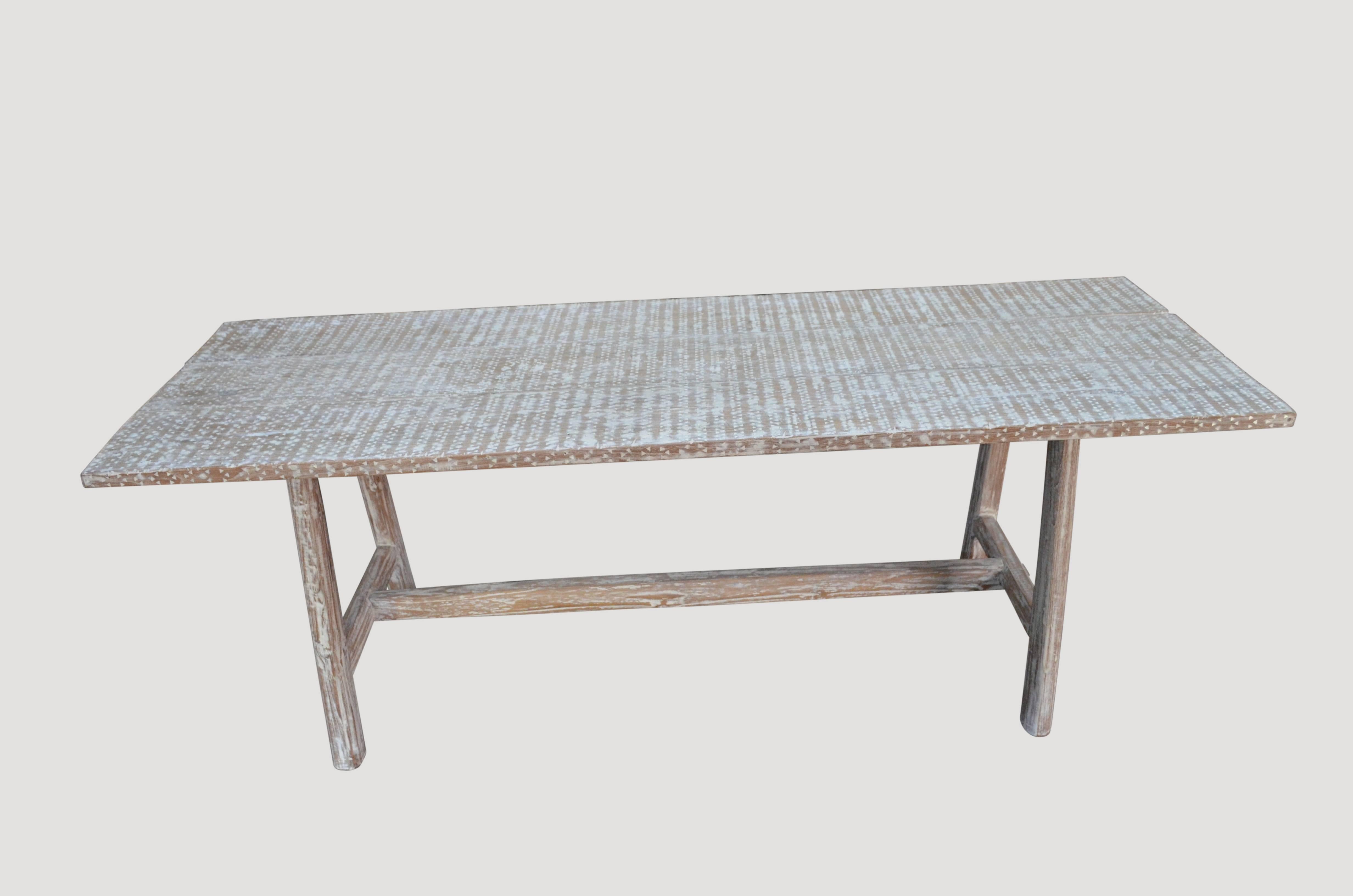 Beautiful dining table, console or desk made from reclaimed teak panels. We white washed and then added by hand a full shell inlay top. 

Own an Andrianna Shamaris original.

Andrianna Shamaris. The Leader In Modern Organic Design.