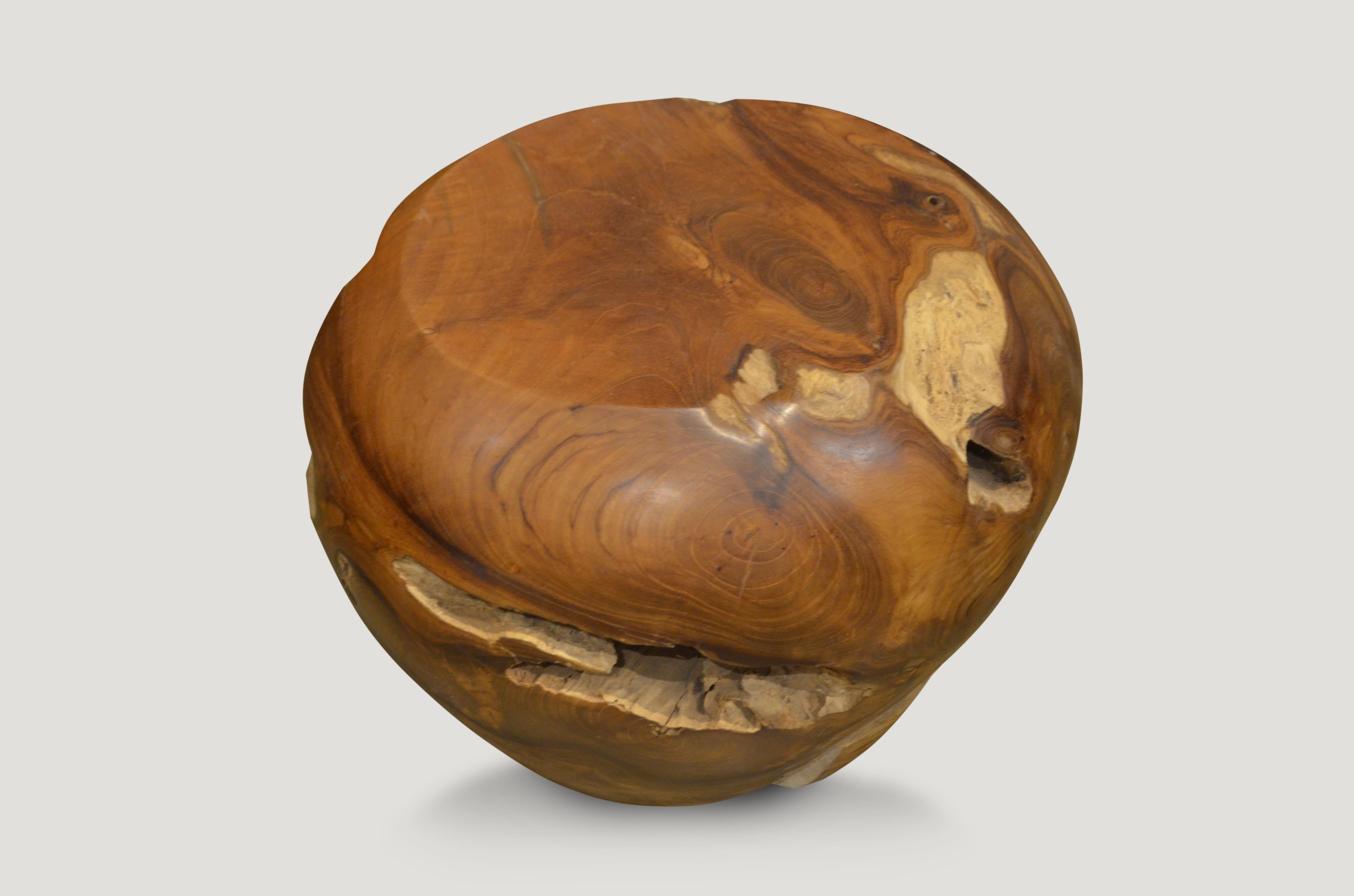 Reclaimed teak wood which we have hand carved into a drum shaped side table. We polished the smooth sections and left the natural crevices raw in contrast.

Measures: 16