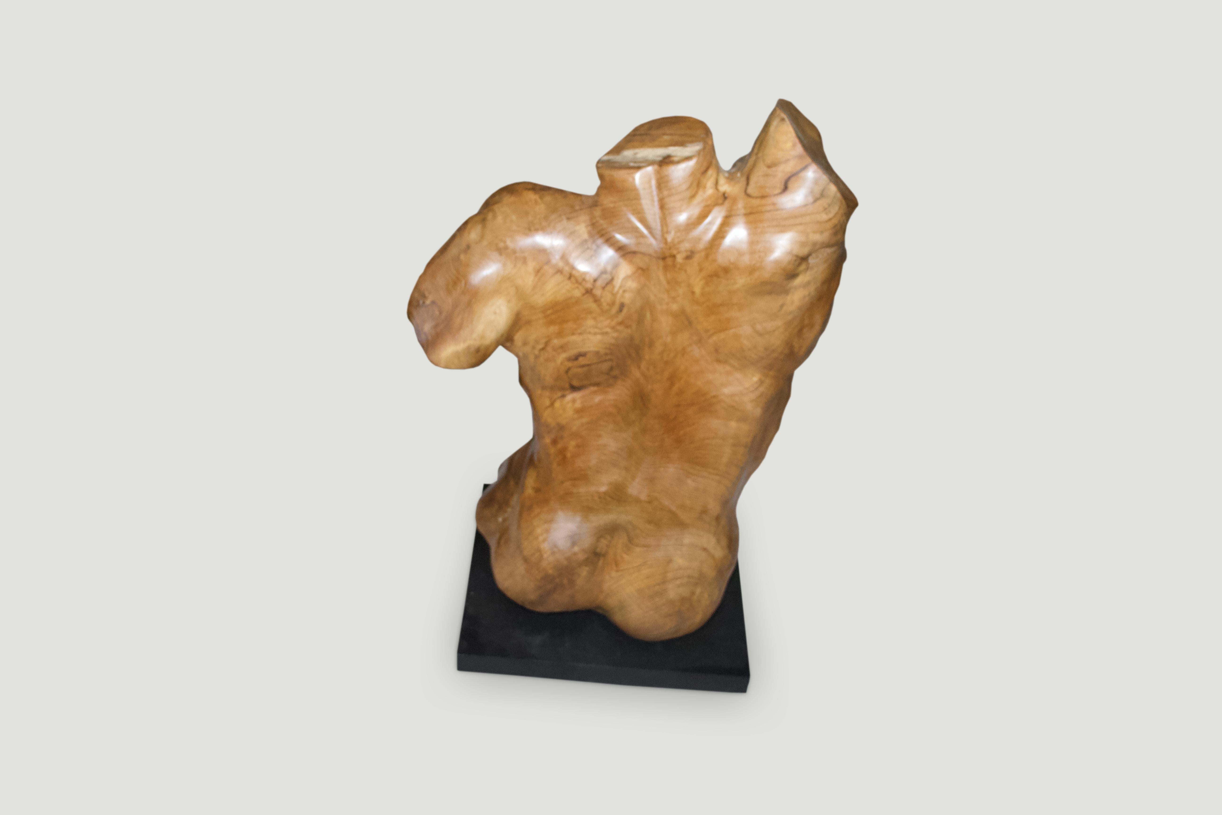 Hand carved from a single reclaimed teak wood root with natural oil finish, a male torso. Shown on a black metal base.

Own an Andrianna Shamaris original.

Andrianna Shamaris. The Leader In Modern Organic Design.
